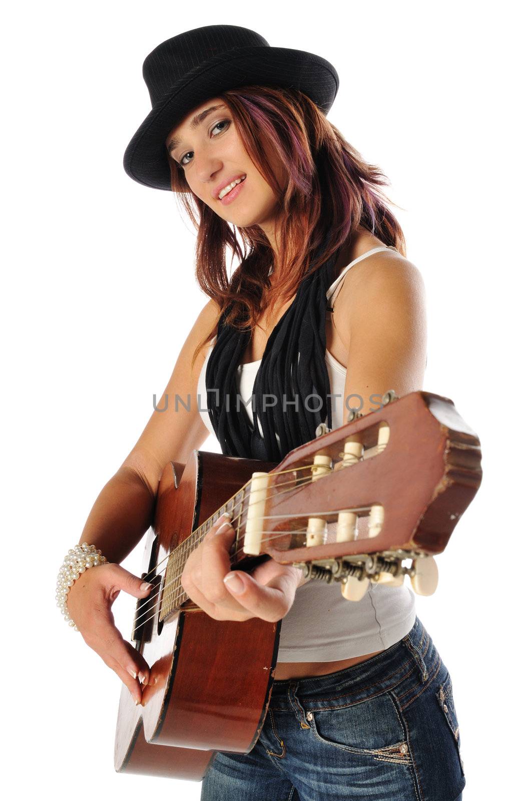 young teen playing the guitar on a white background
