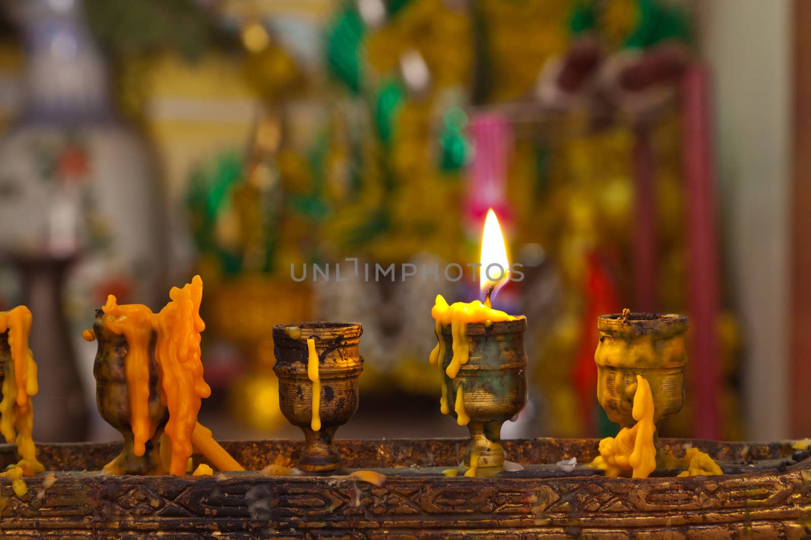 Candles lighting in temple by FrameAngel