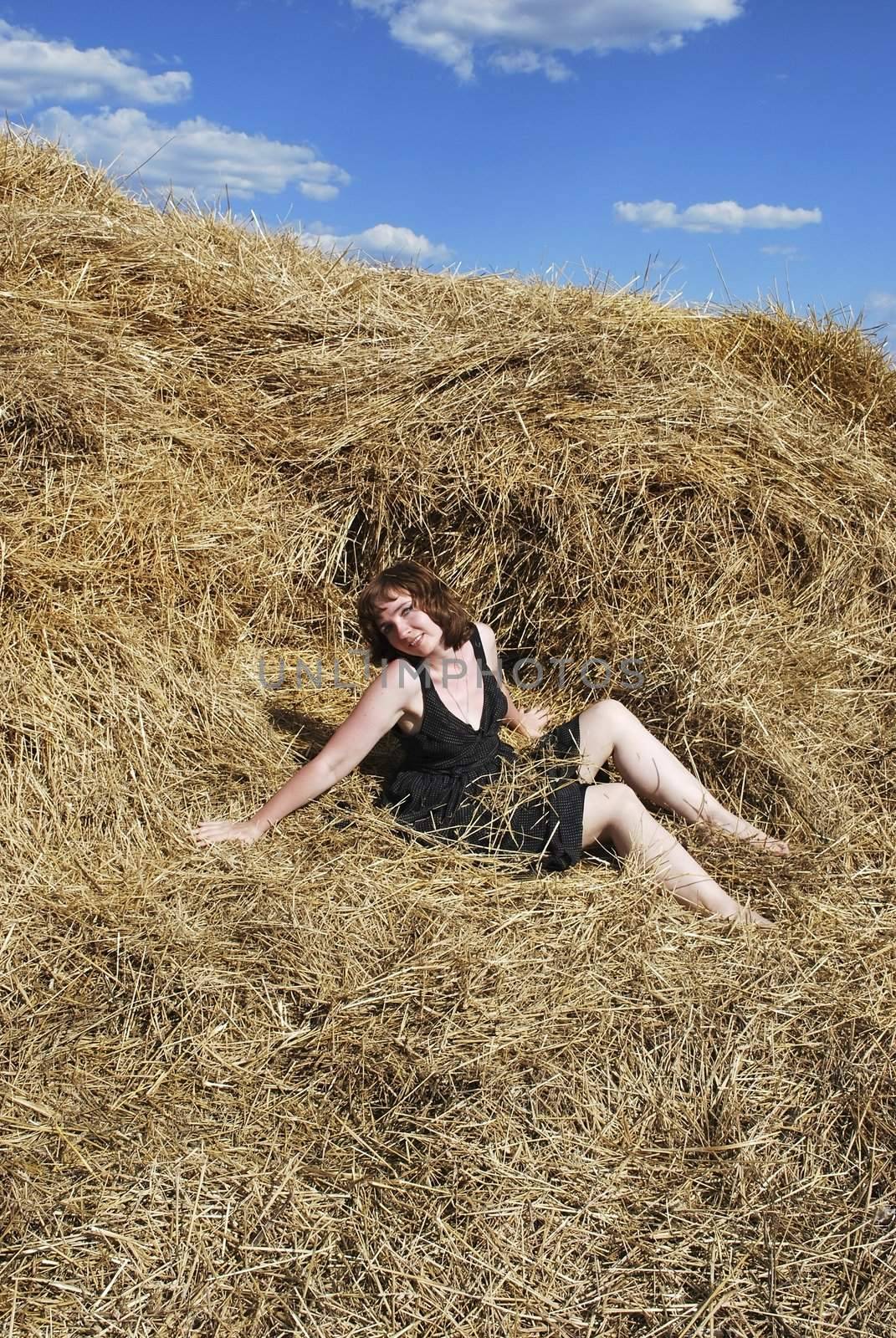 the young woman is relax on the hay