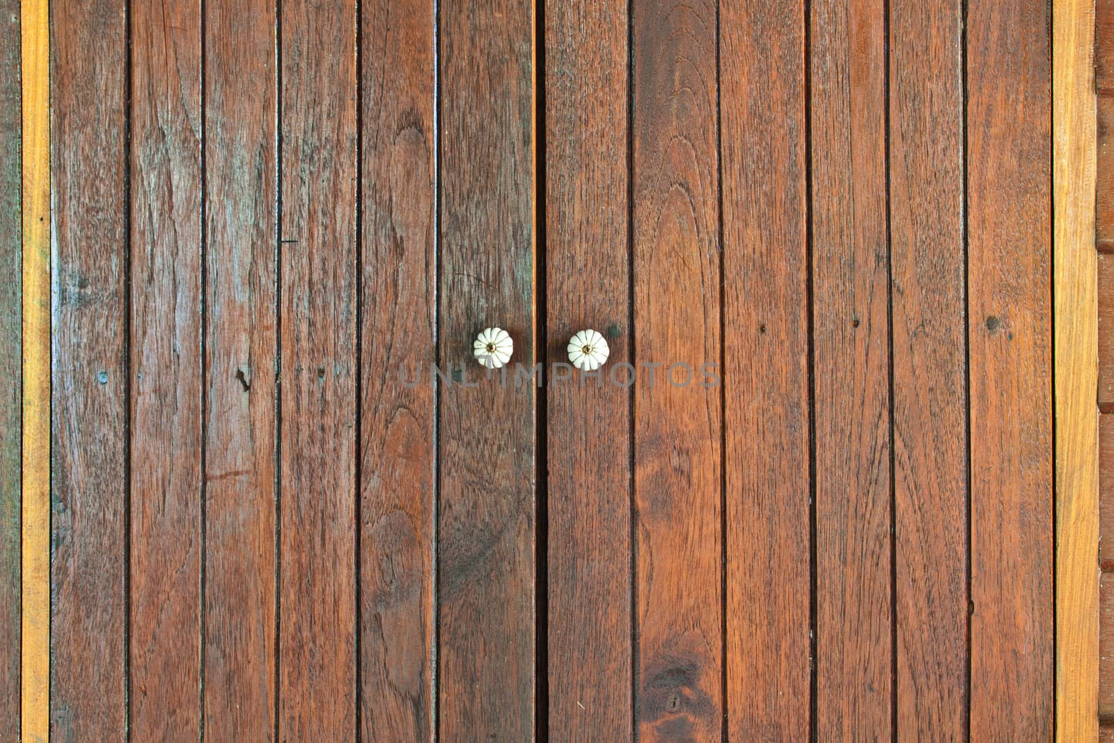 Closed window with old wood shutters