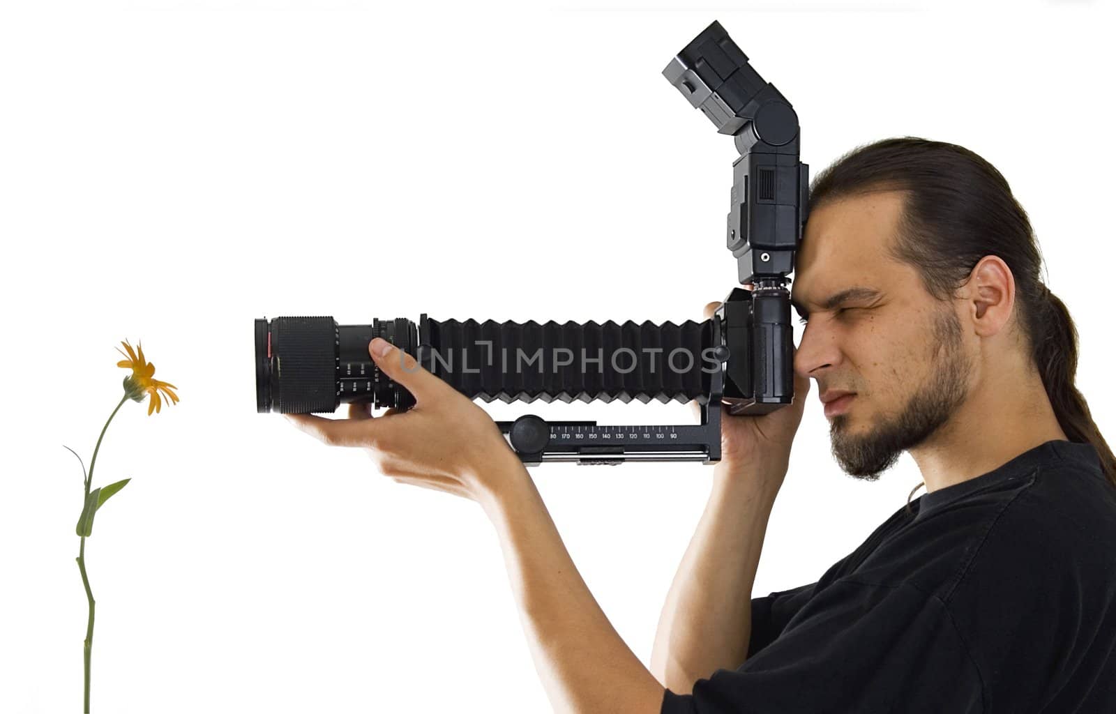 Young photographer with macro equipment isolated on white