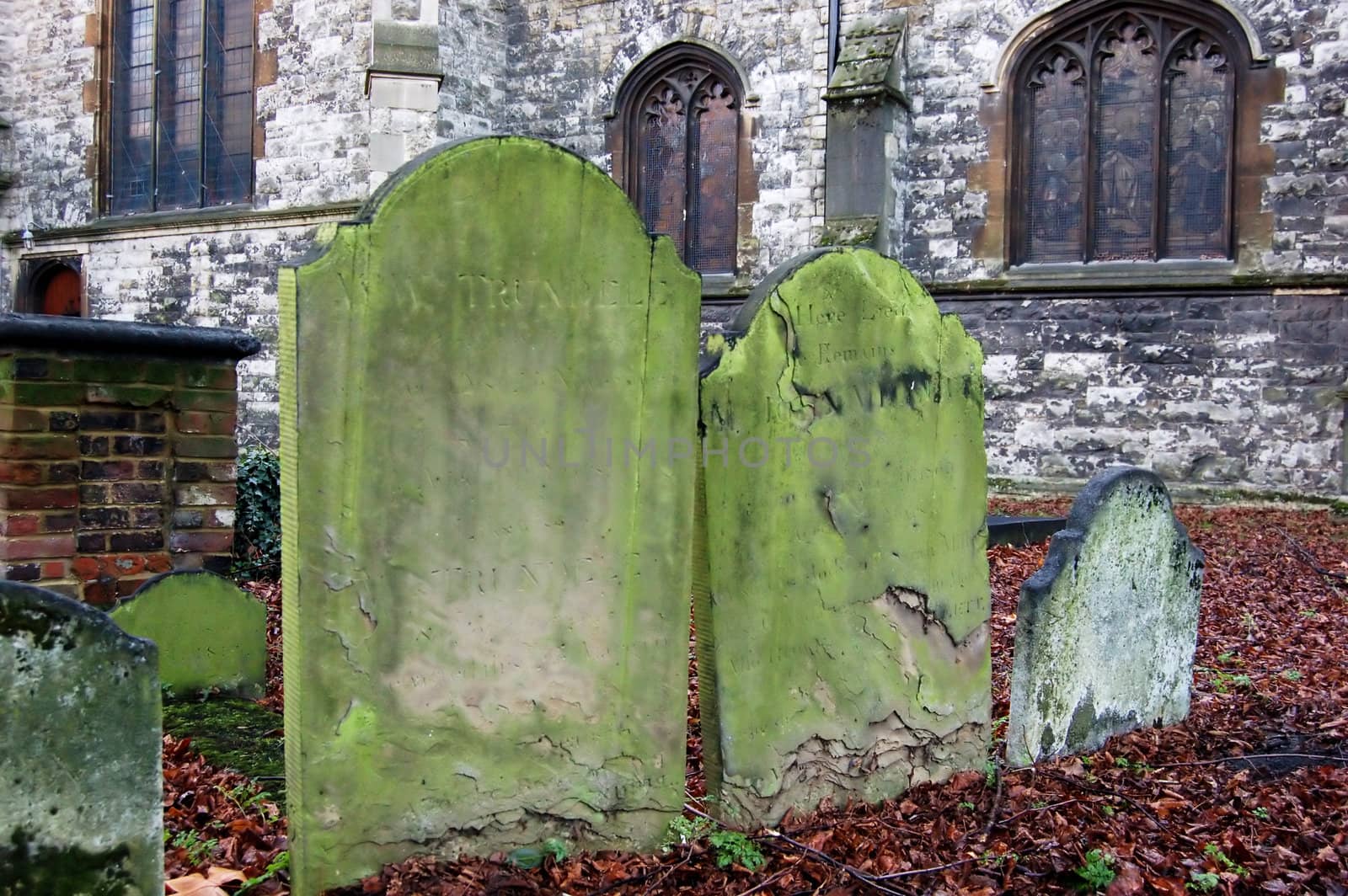 Very old tombs on graveyard near All Saints Church in London.