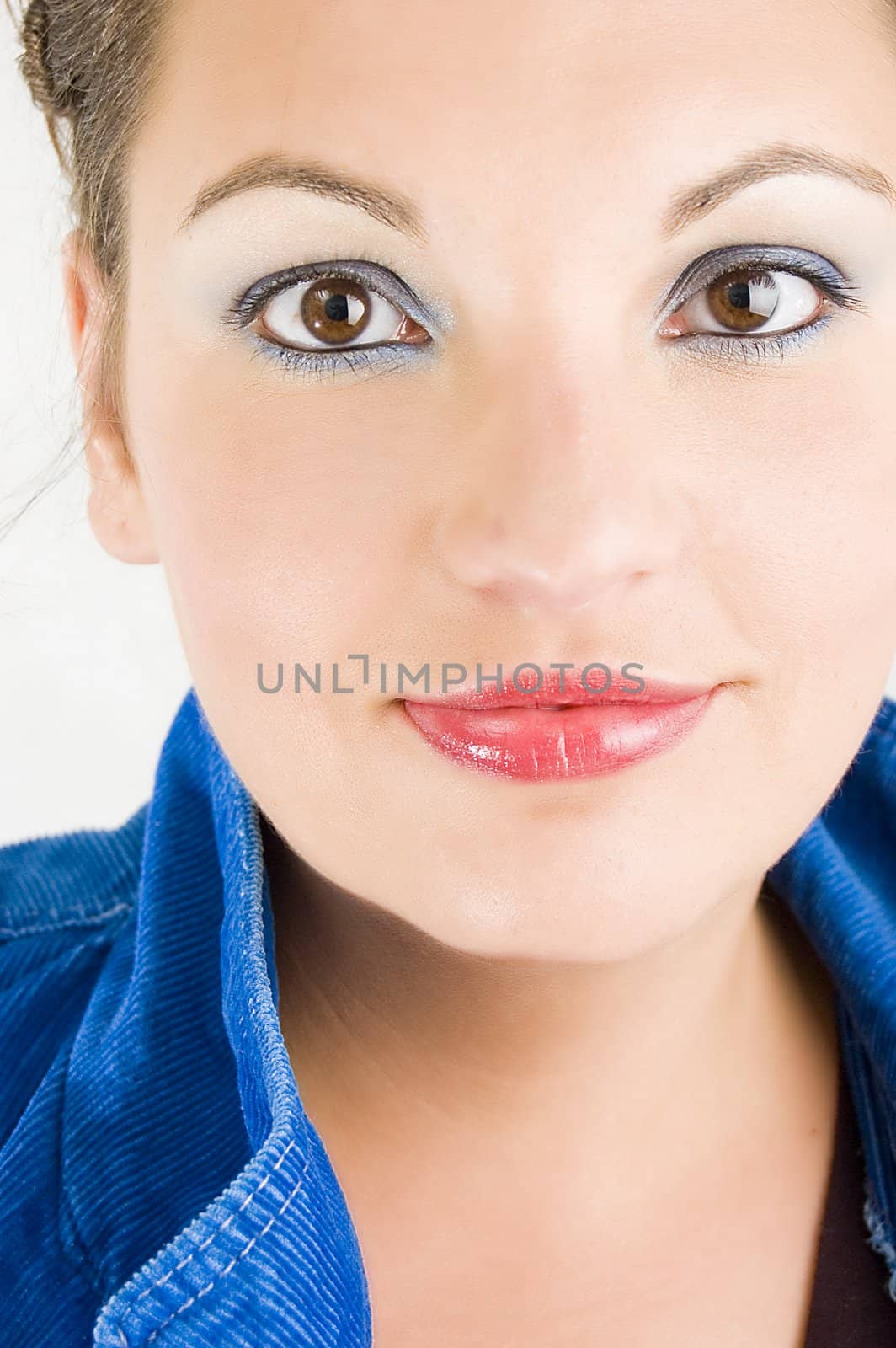 Portrait of beautiful young woman with blue eyes.