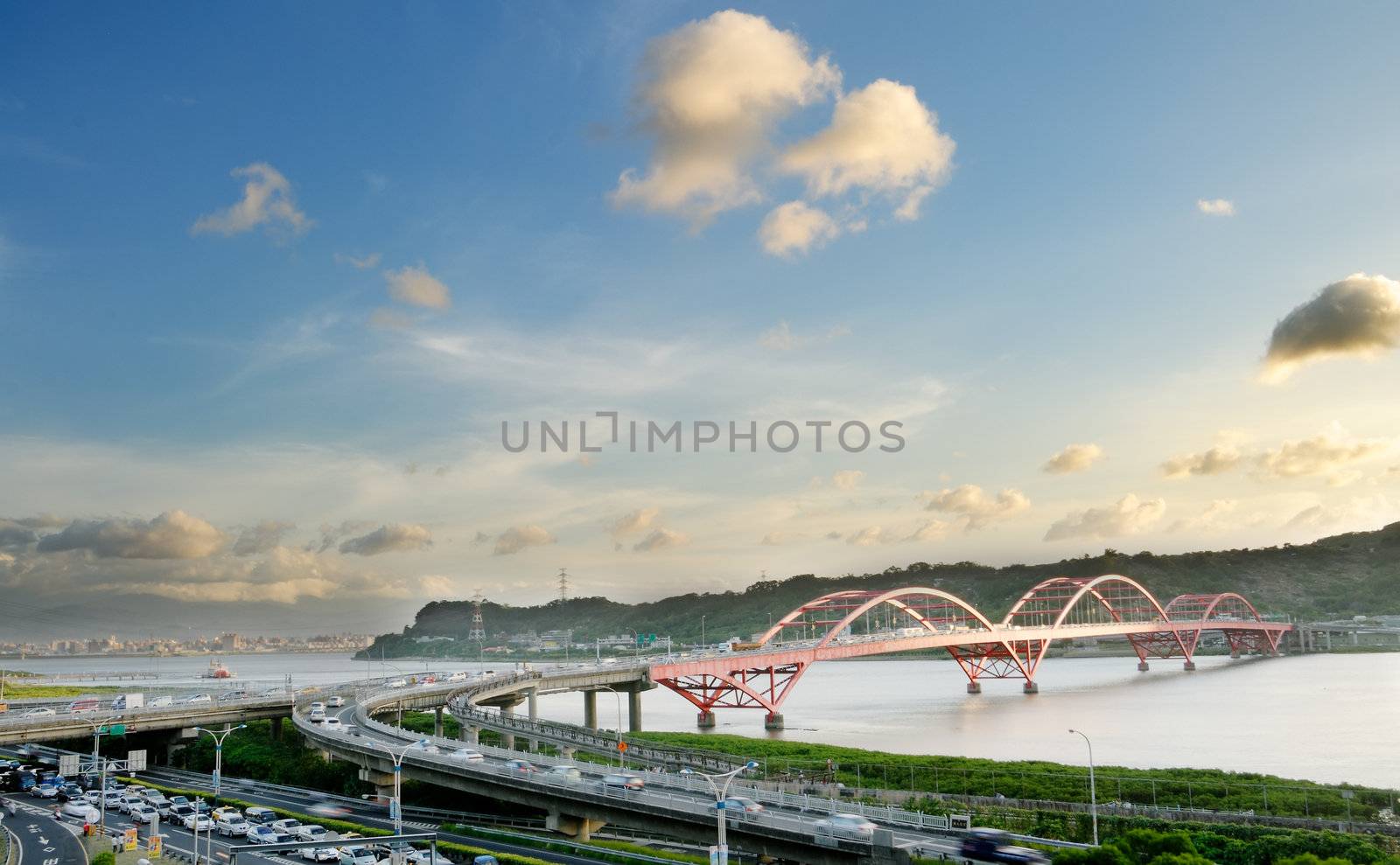 It is a beautiful cityscape of bridge with blue sky.