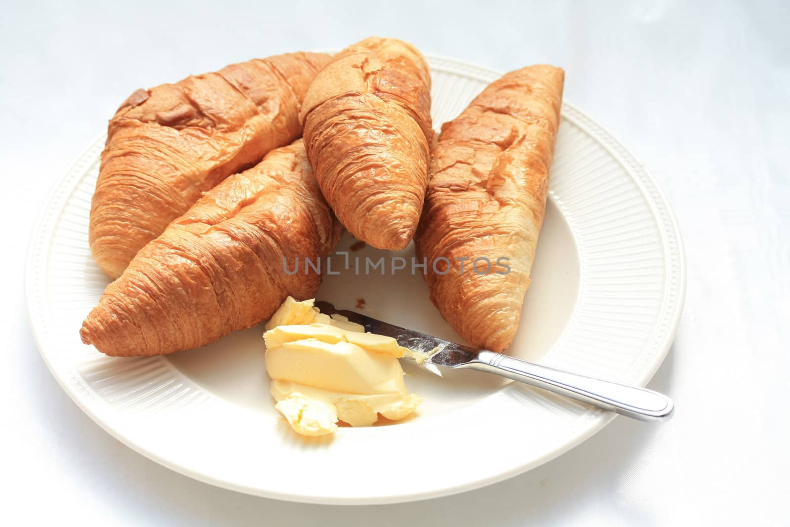 Typical french breakfast: croissants with butter