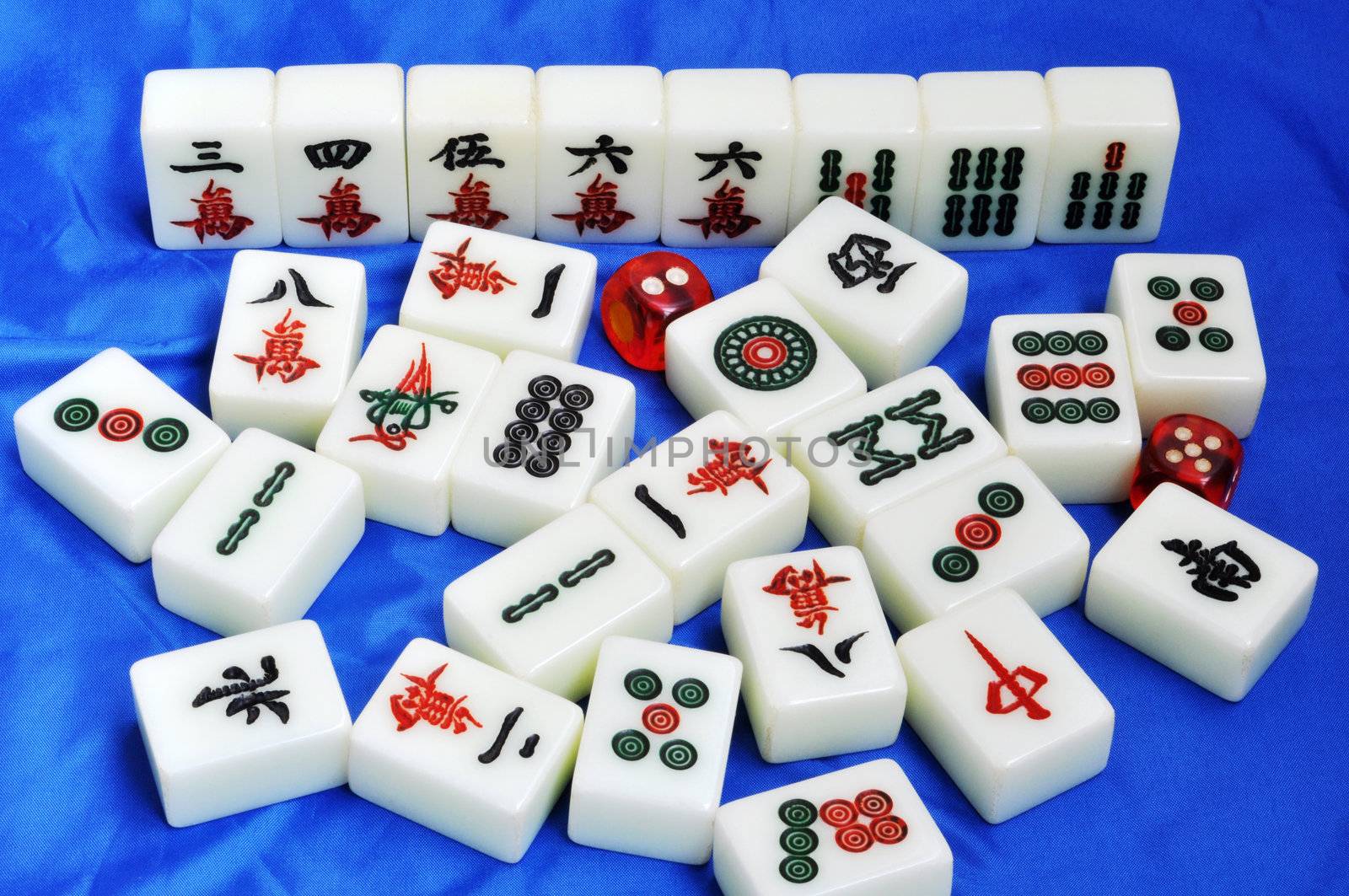 Chinese mahjong tiles on a blue background