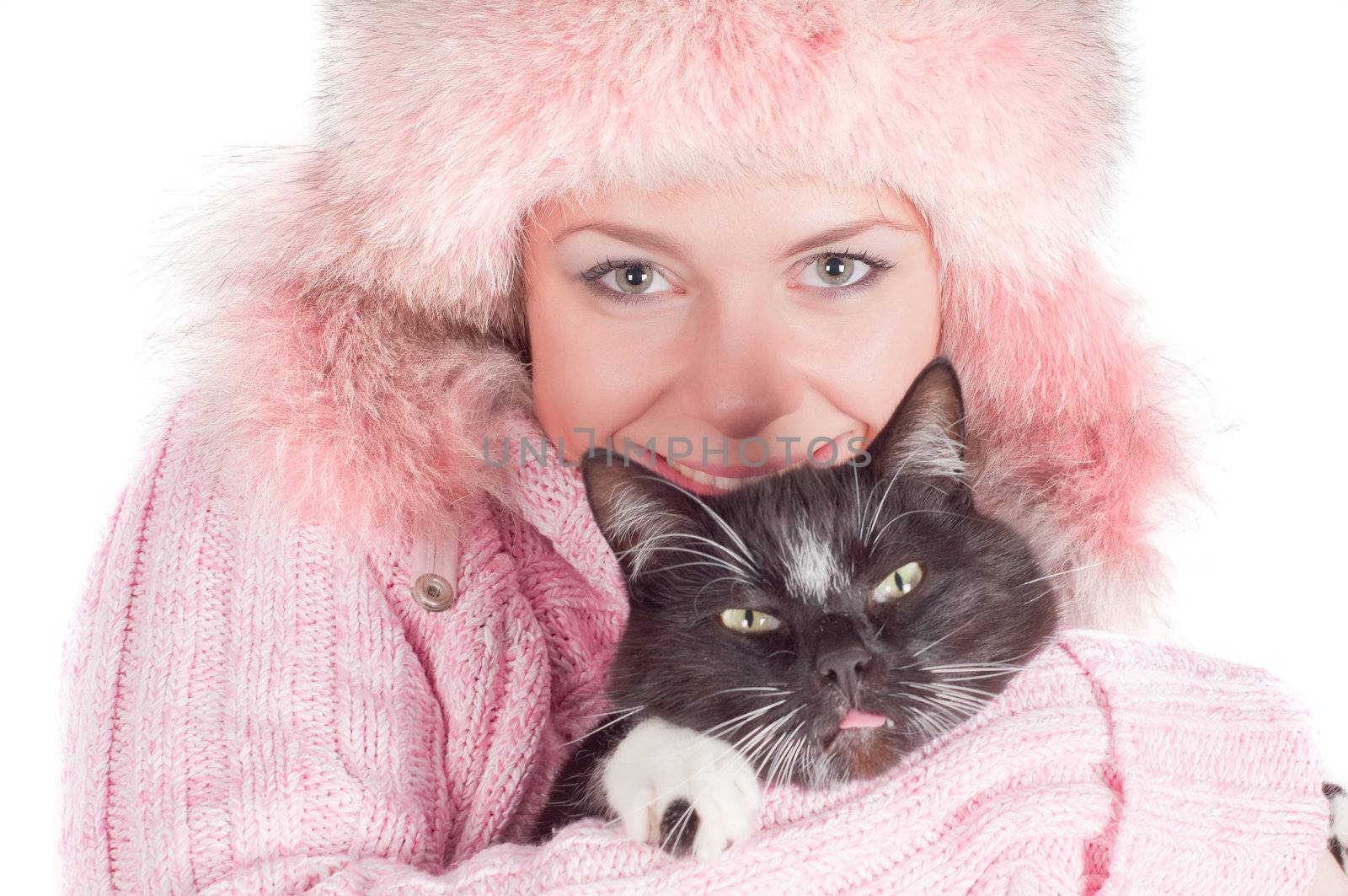 Woman in pink with black cat in studio