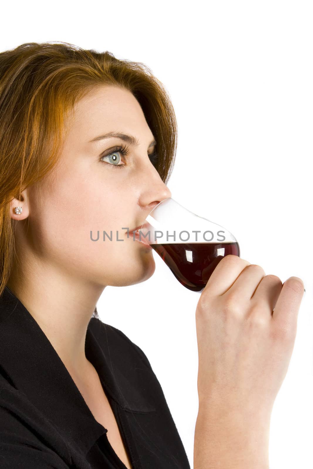 Beautiful young woman drinking red wine isolated