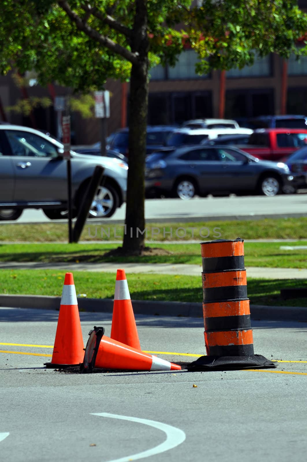 Orange traffic cones at road work site.