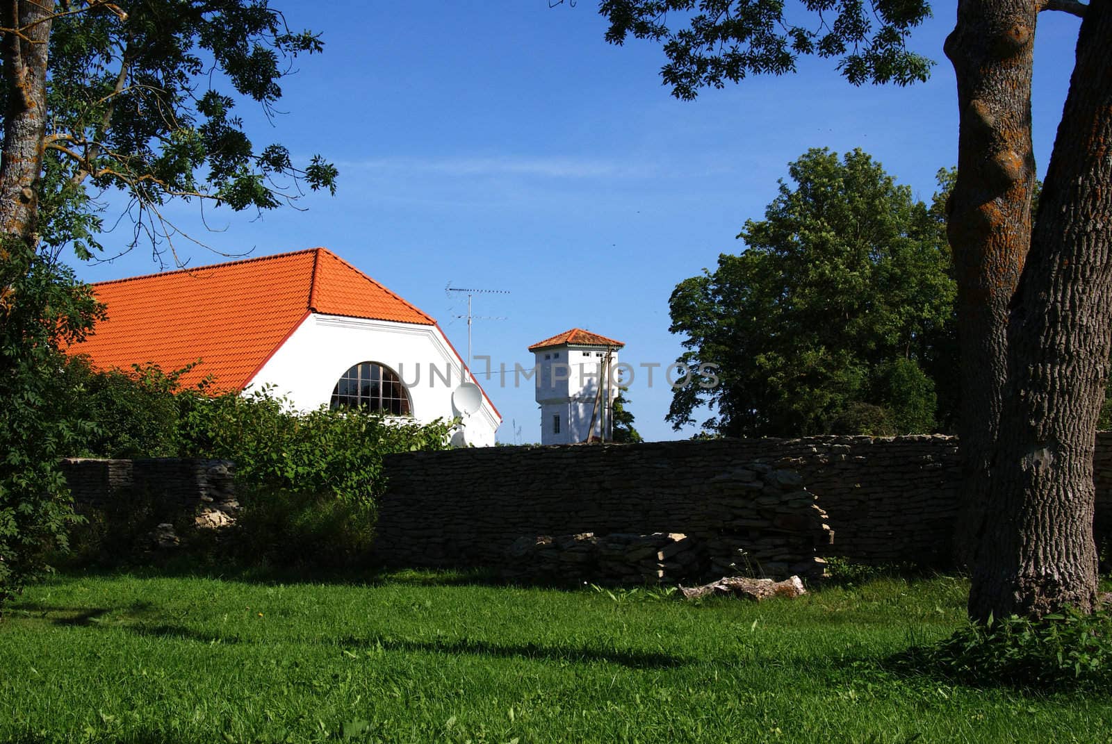 The house and tower behind an old wall