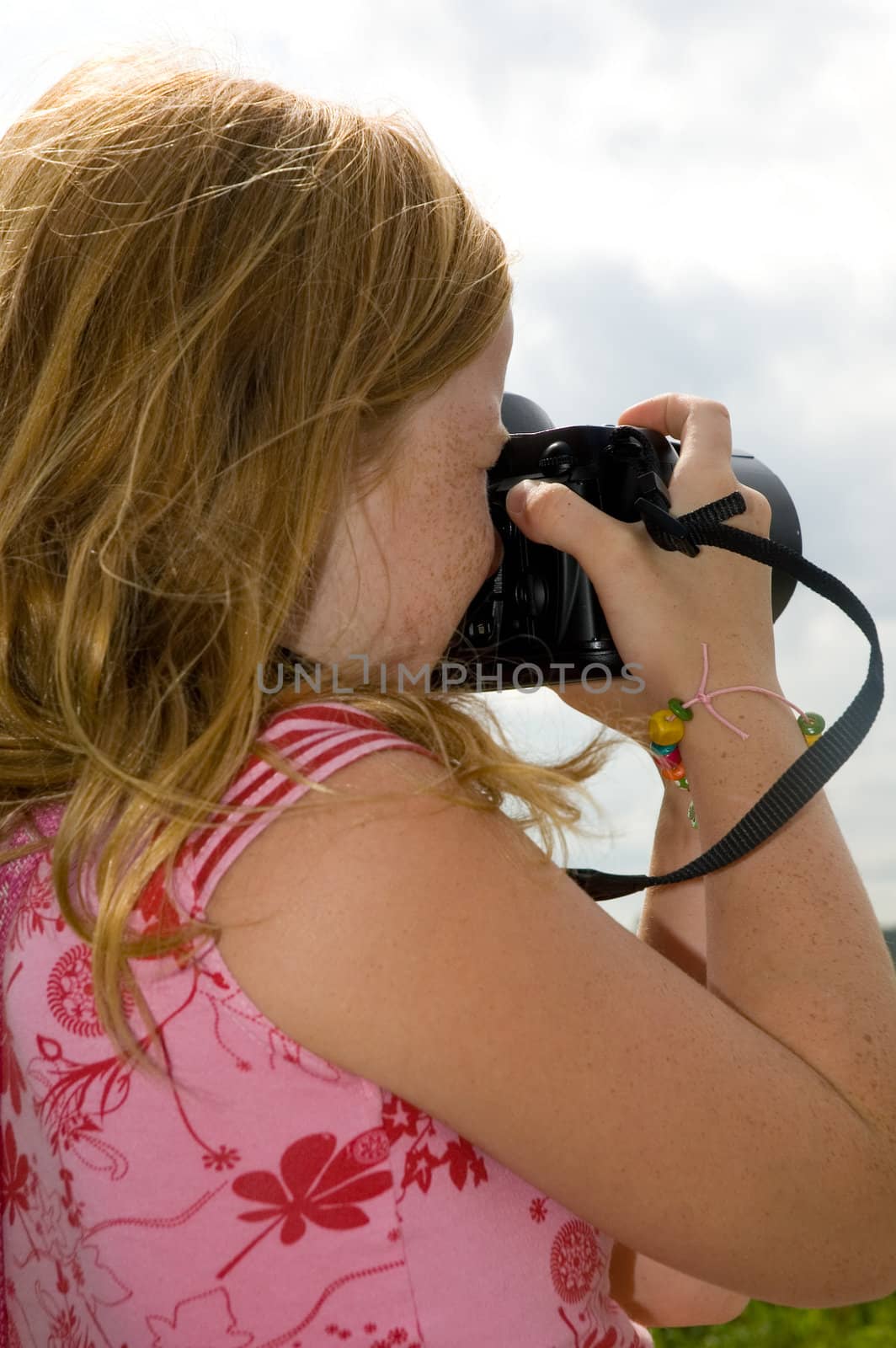 young girl is playing for photographer