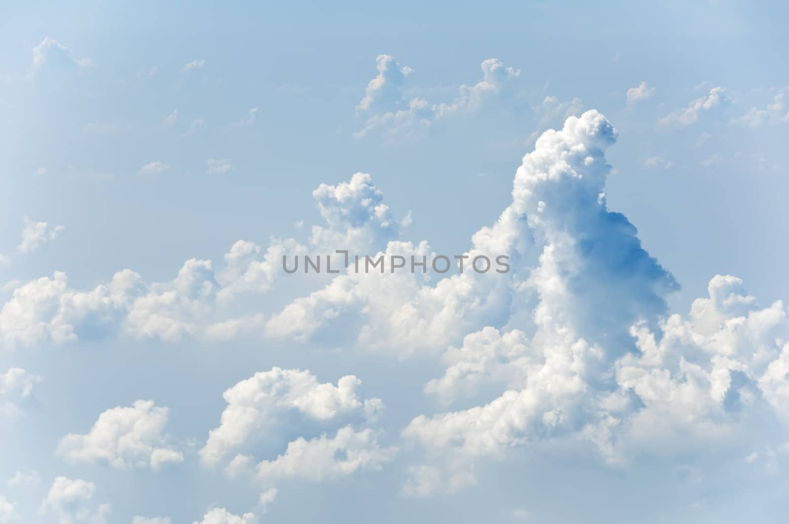 Fluffy clouds shot from airplane window