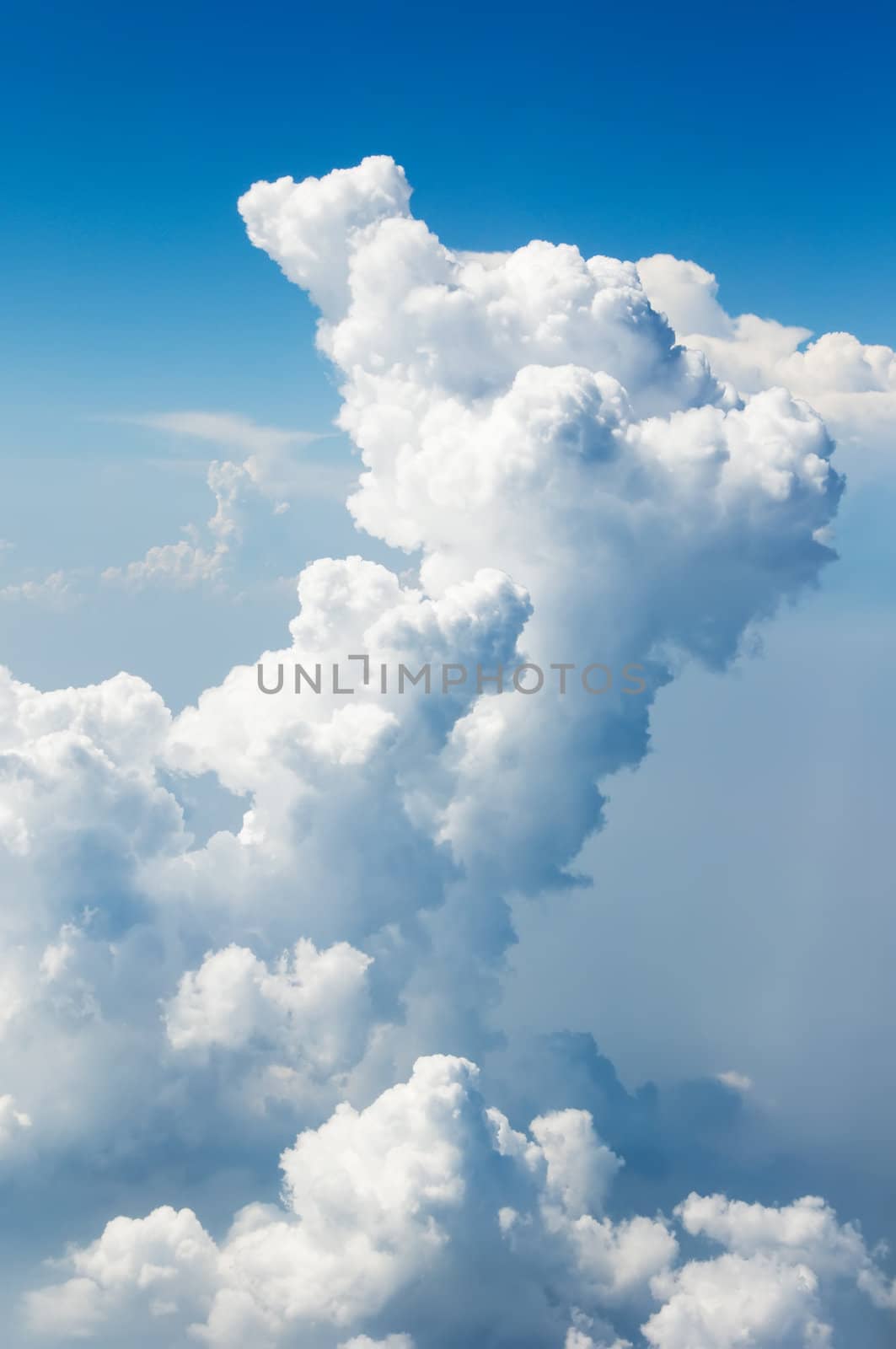 Fluffy clouds shot from airplane window