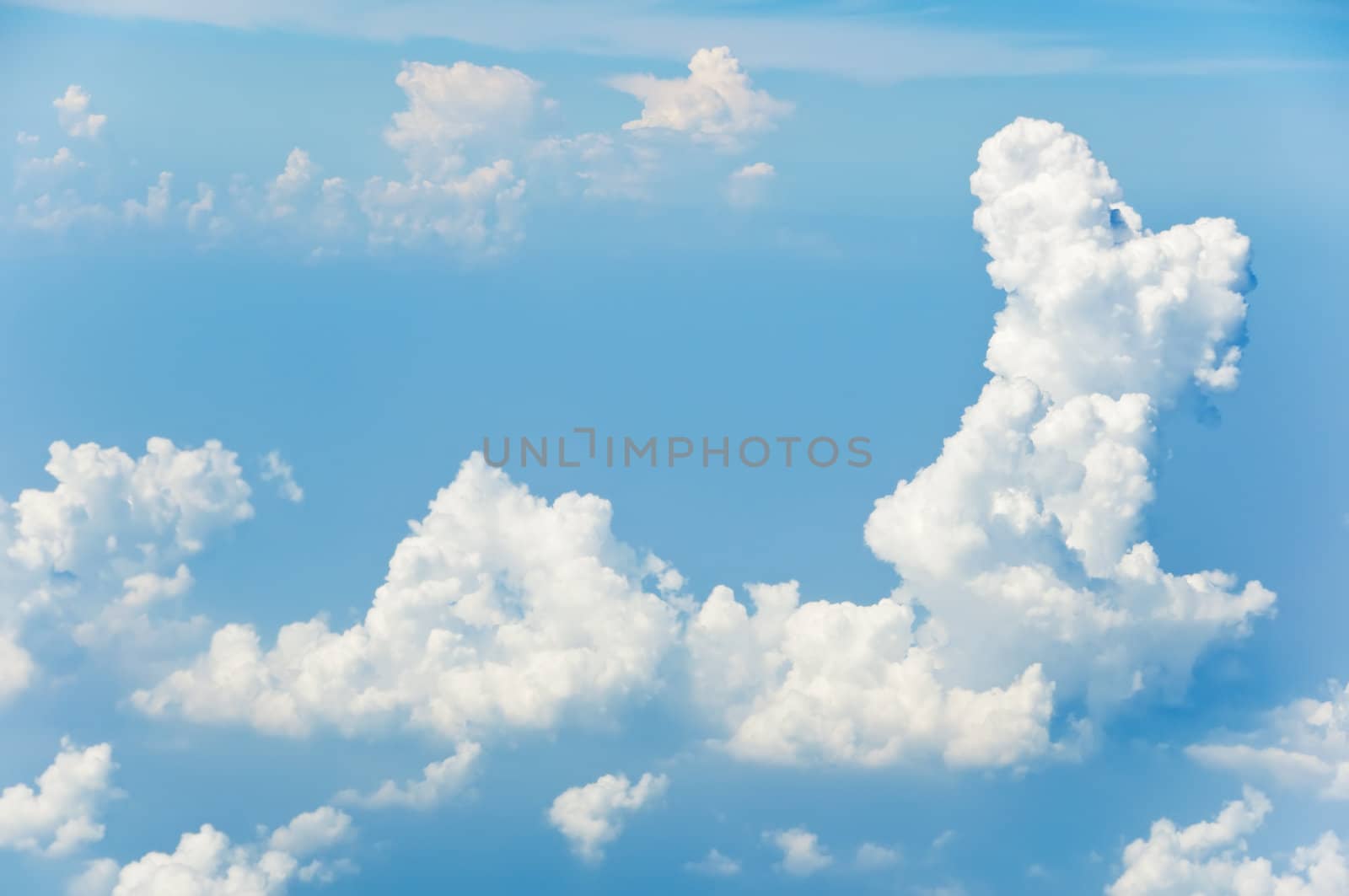 Fluffy clouds shot from airplane window