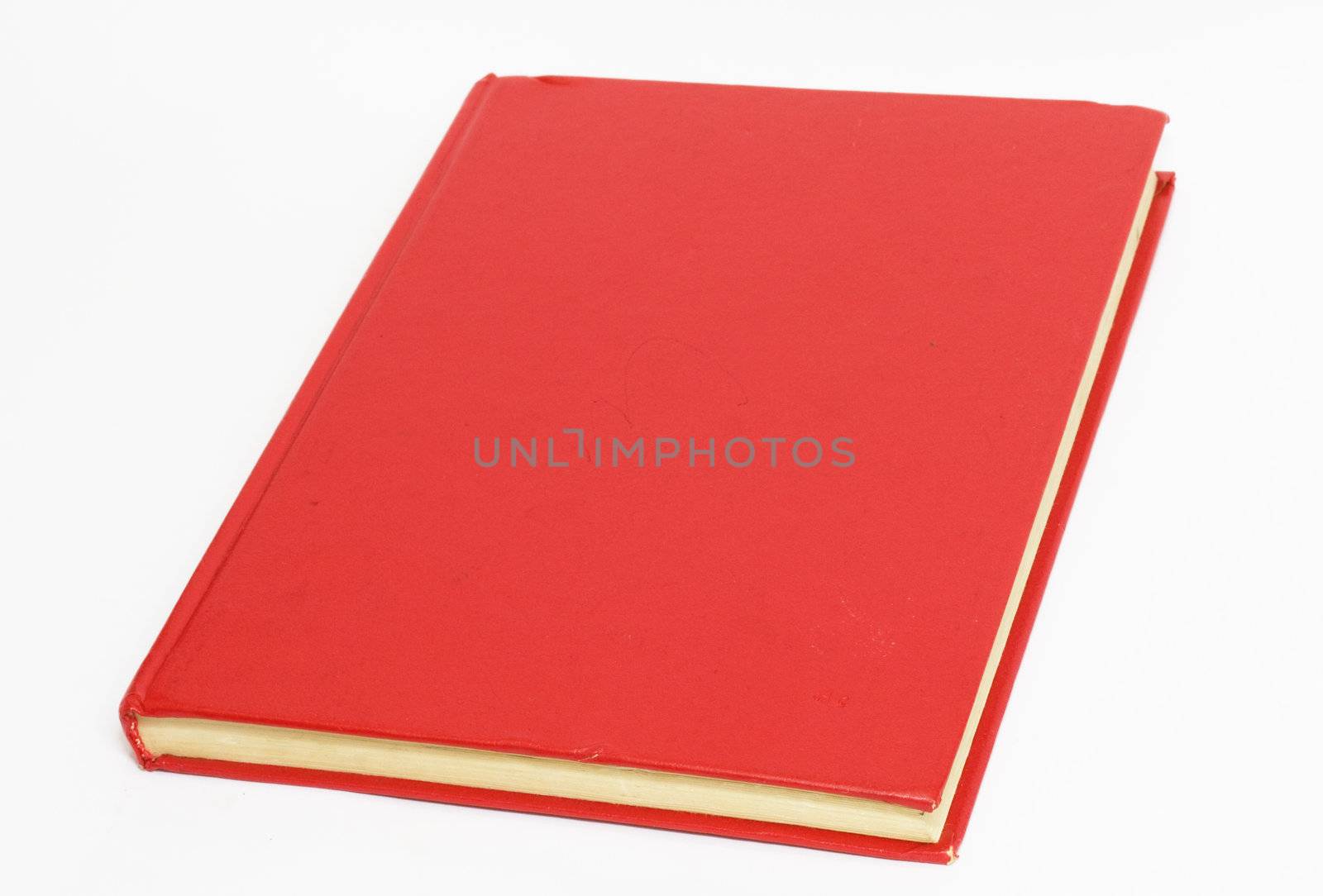 Red book on white background  by schankz