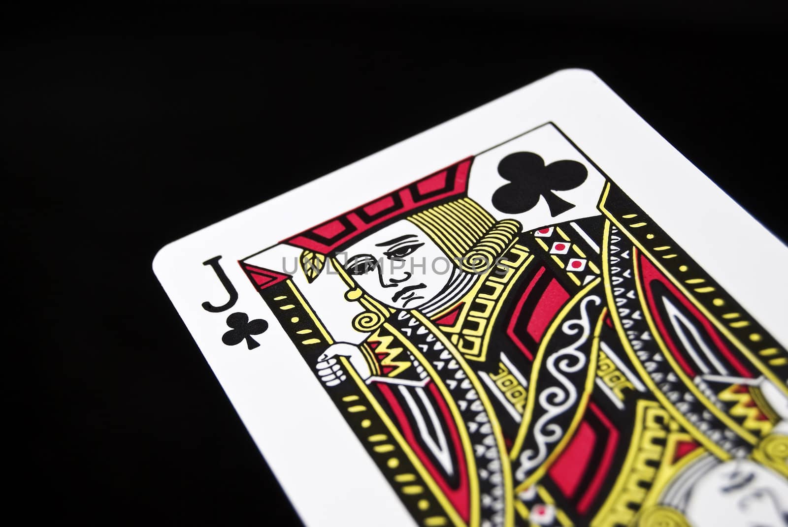 Jack of Clubs against black background