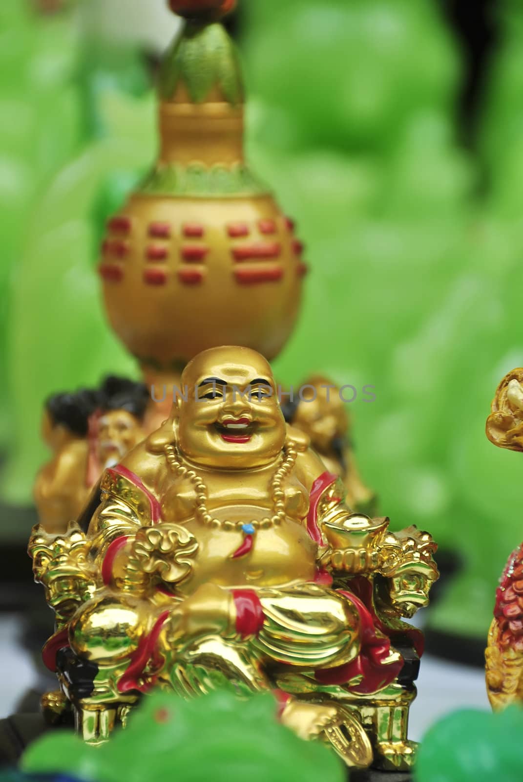 Golden Buddha for sale on sidewalk during Chinese New Year