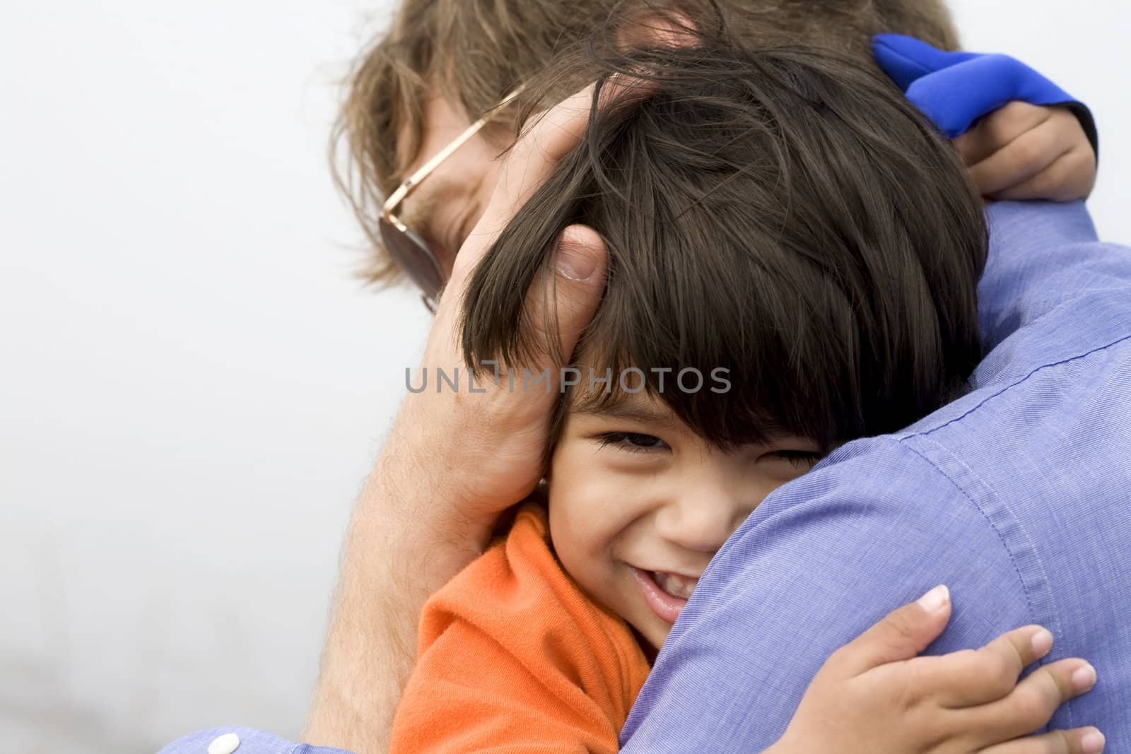 Son hugging his father by jarenwicklund