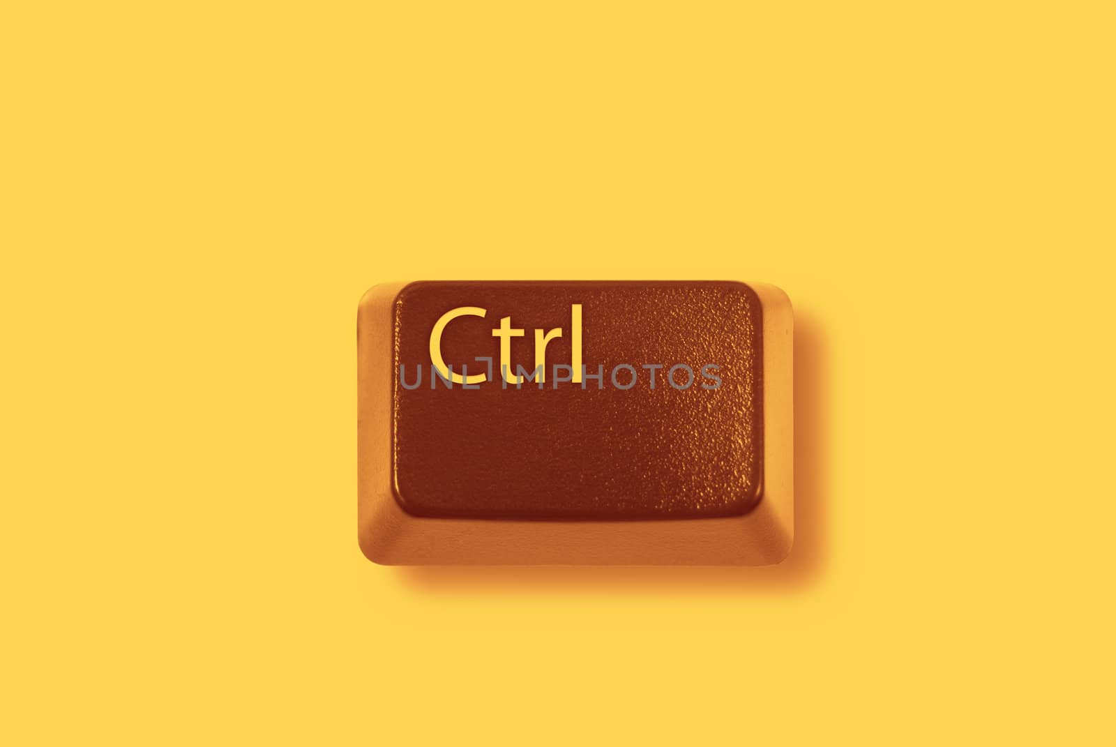 Red "CTRL" computer key on yellow background