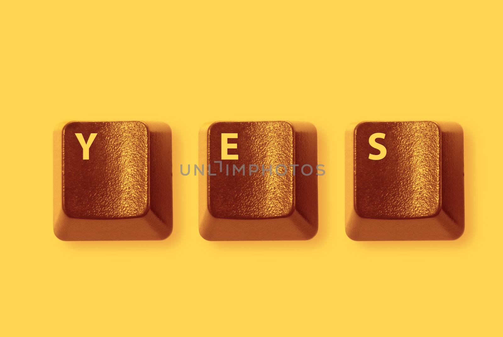 Red computer keys spelling "YES", on yellow background