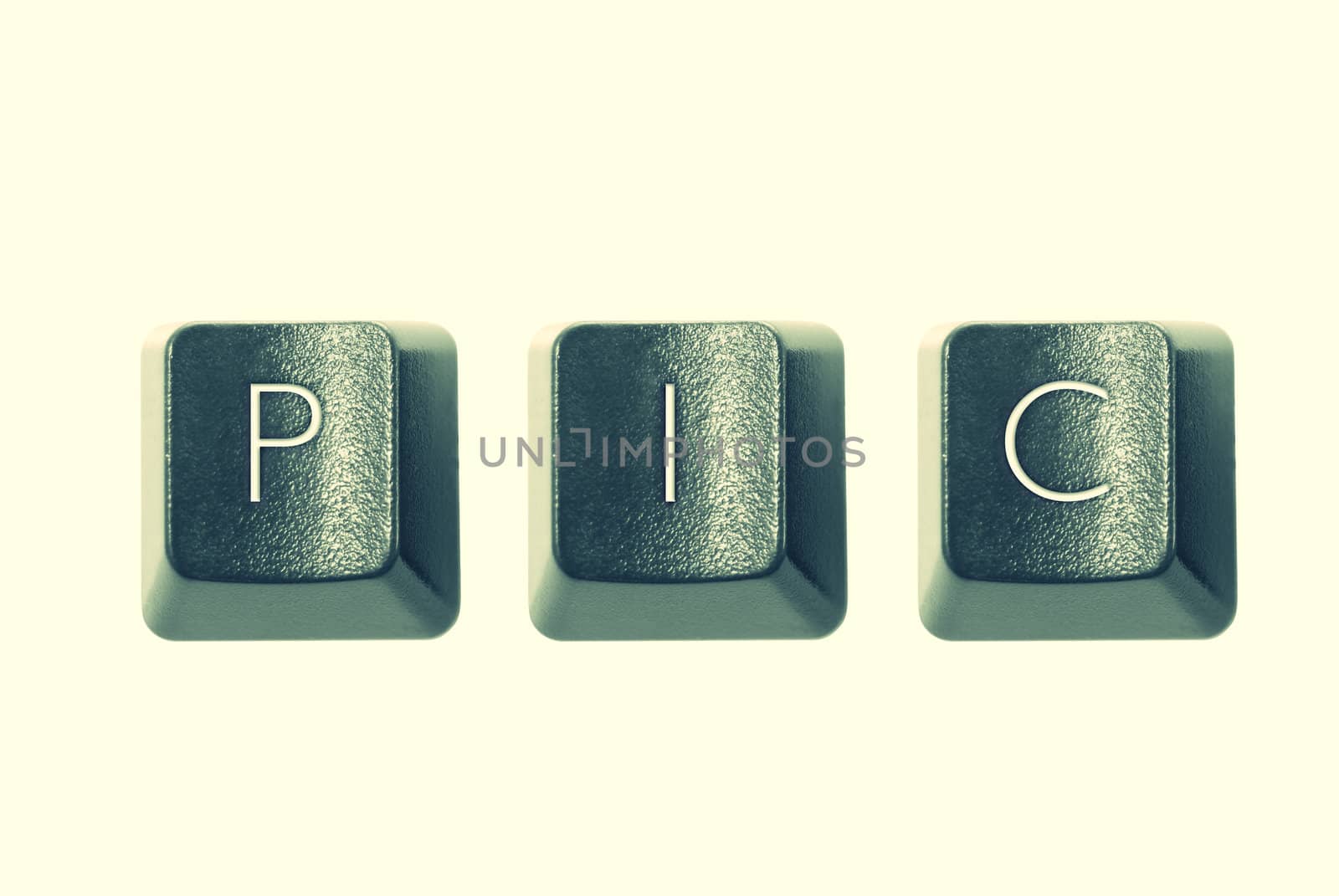 Cross-processed computer keys, spelling "PIC"