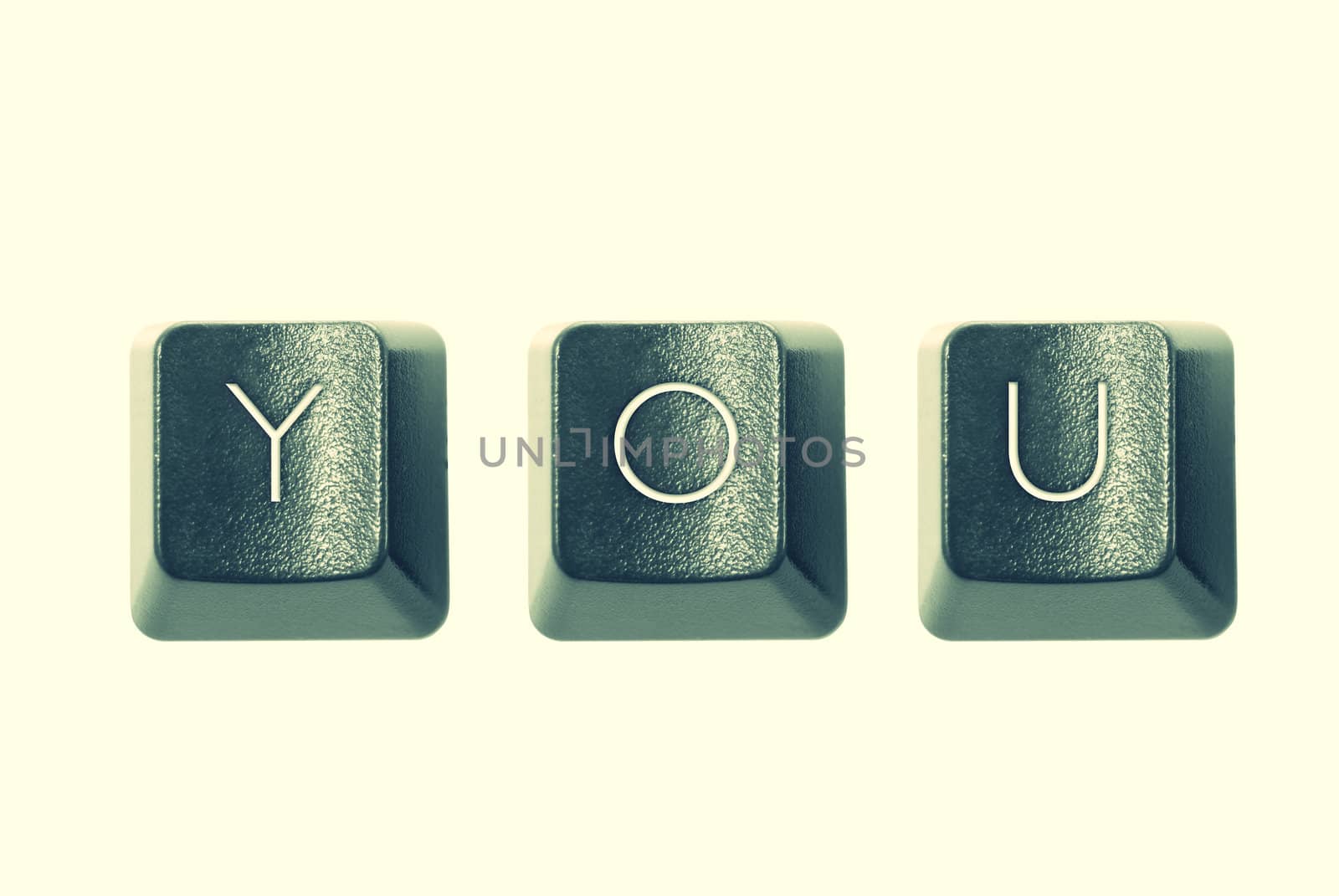 Cross-processed computer keys, spelling "YOU"