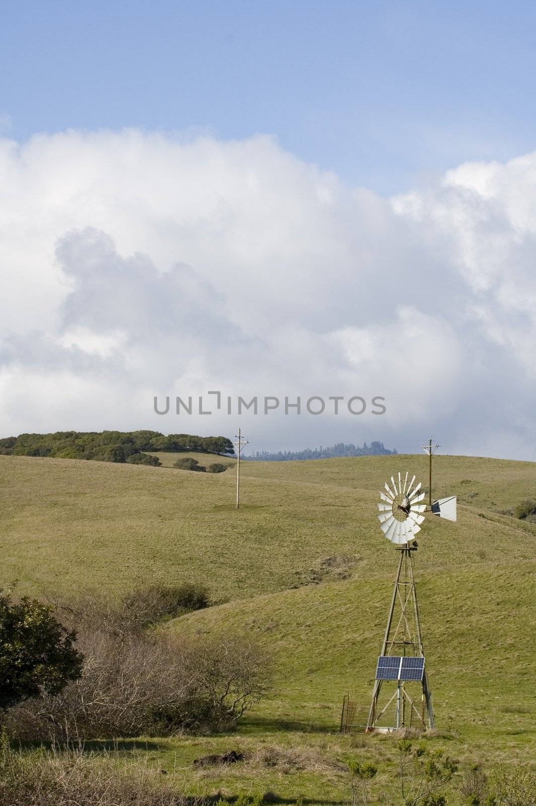 Alternate energy - Wind powered pump and solar panel