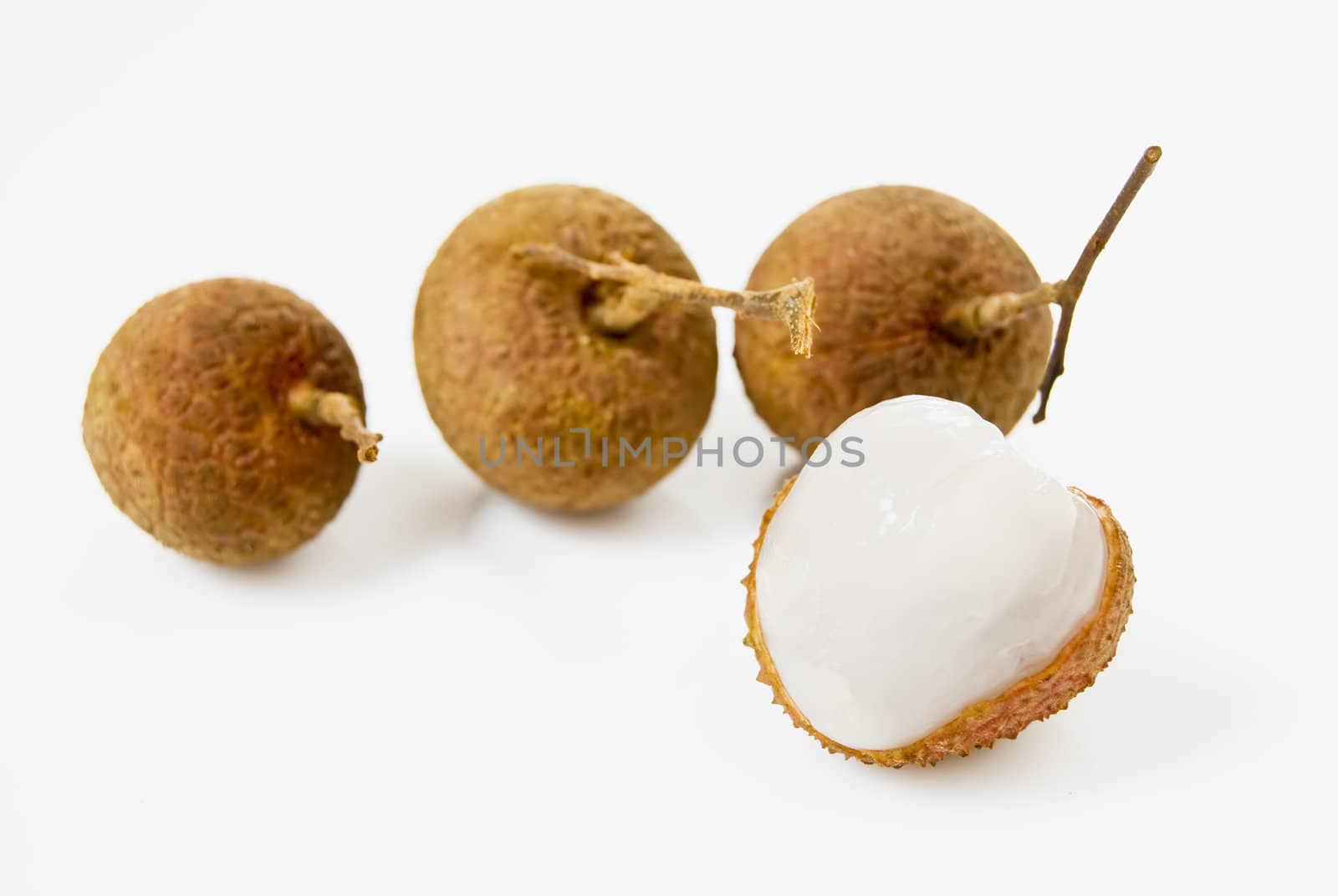 Four pieces of Lychees on white background