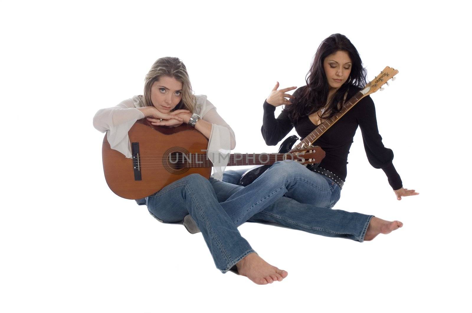 Hispanic and caucasian women guitarists resting and isolated over white