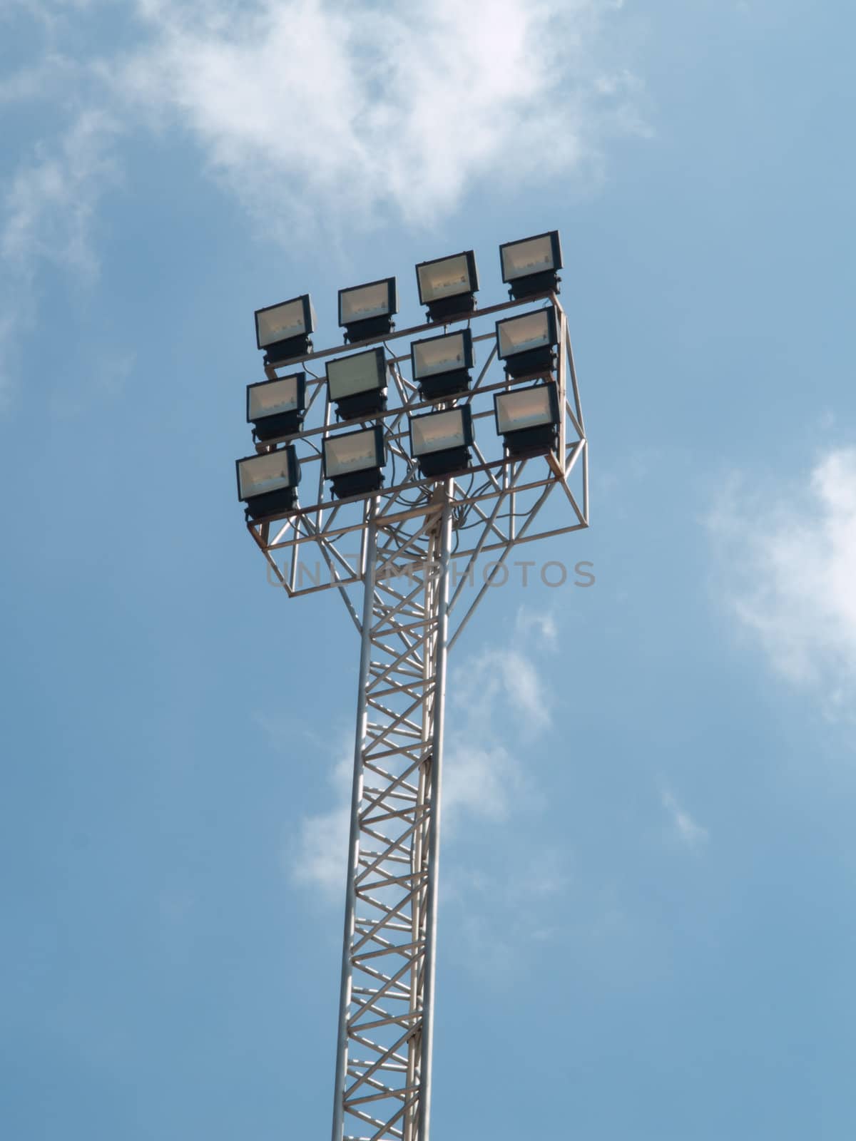 football stadium floodlight that  against blue sky by FrameAngel