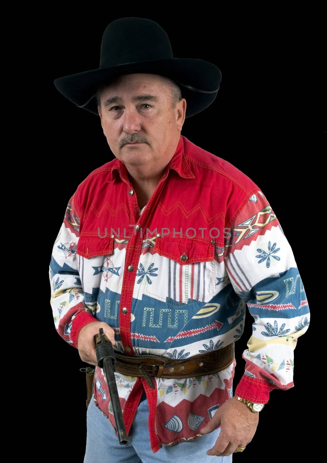 Old cowboy drawing  revolver on a black background