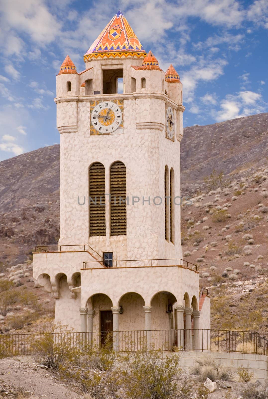 Scotty's Castle in Death valley in the mountains with clouds overhead