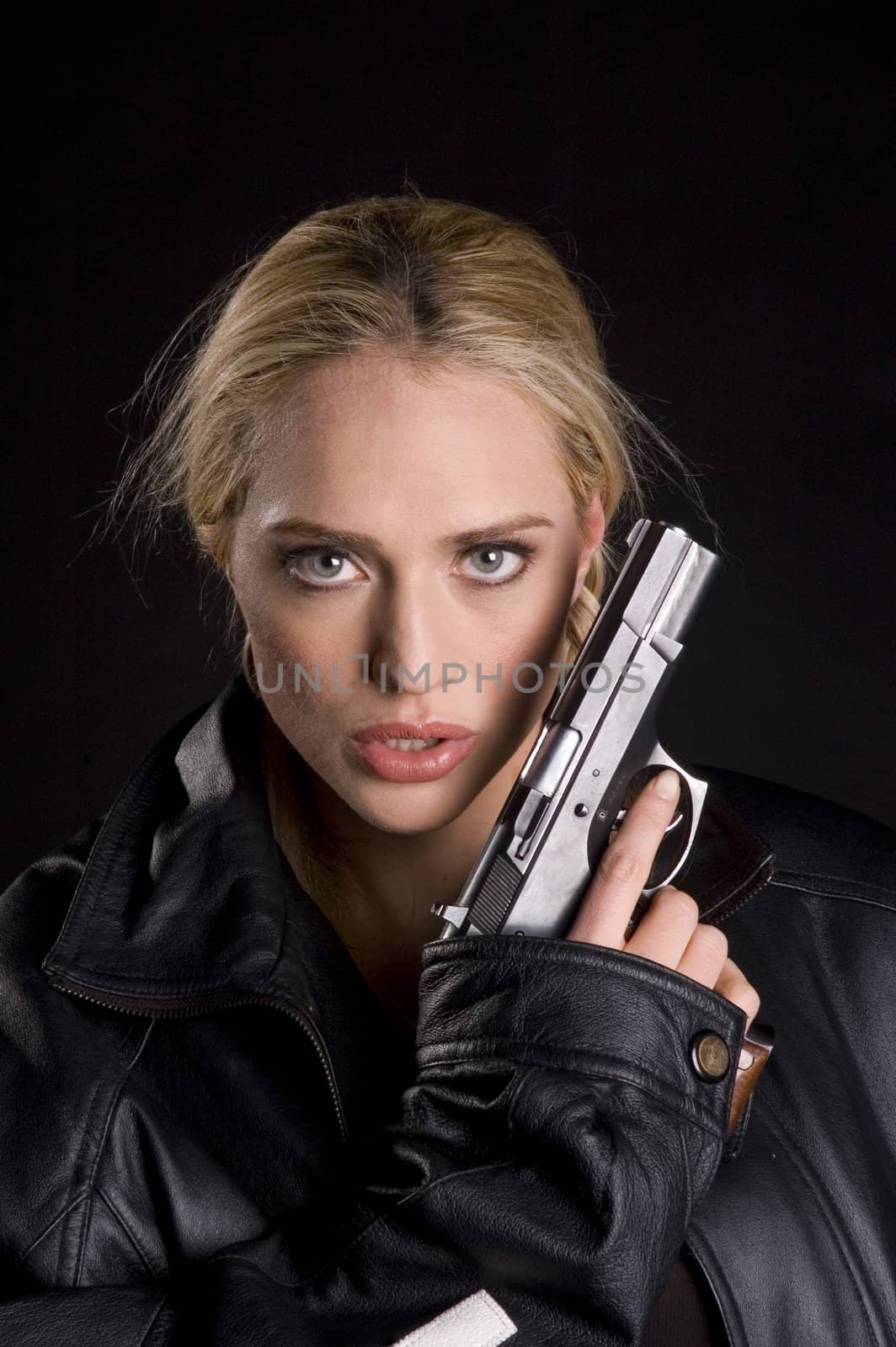 Female motorcyclist with a gun and helmet