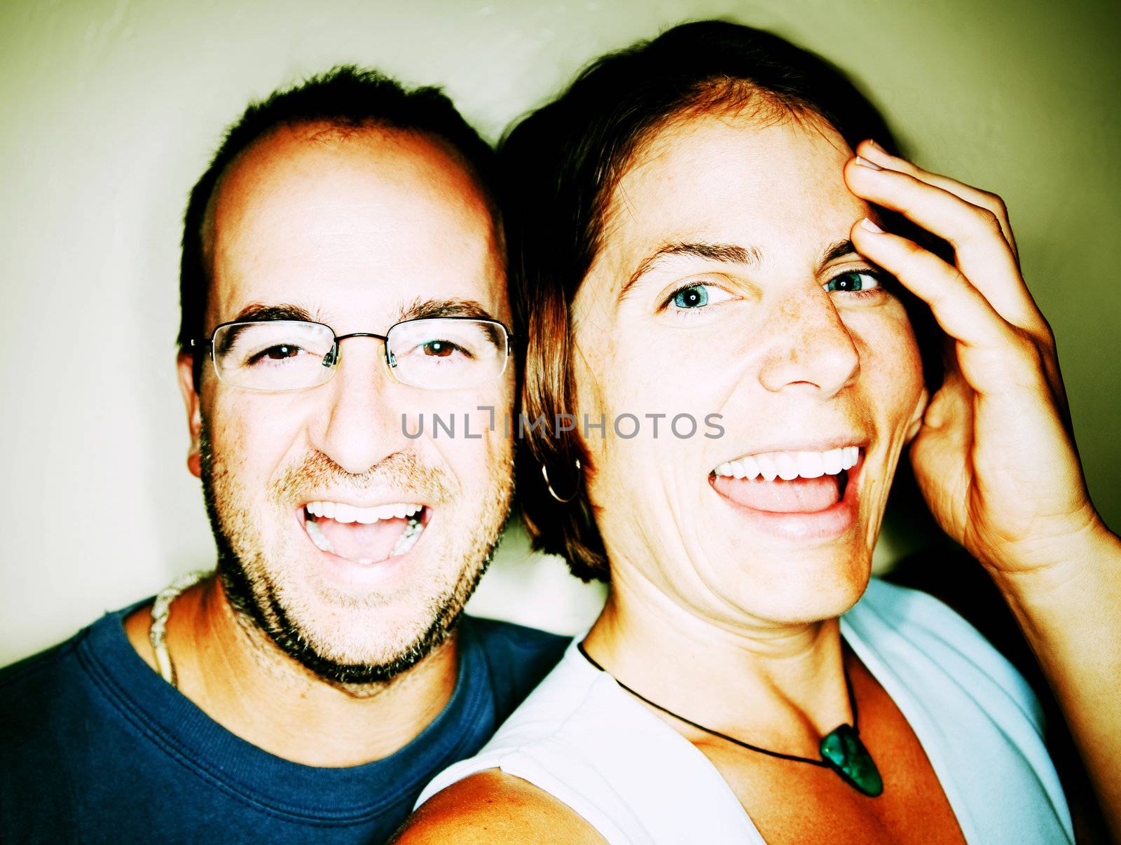 Close up shot of attractive couple laughing