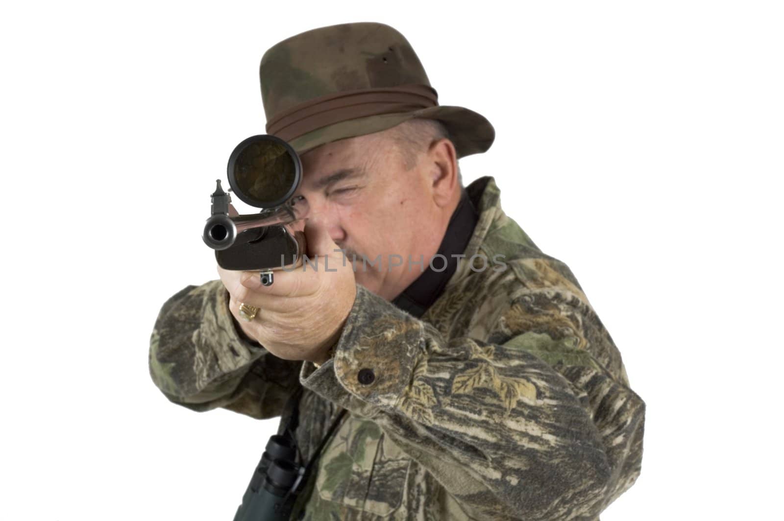 Man in camouflage clothing with rifle taking aim at target on a white background