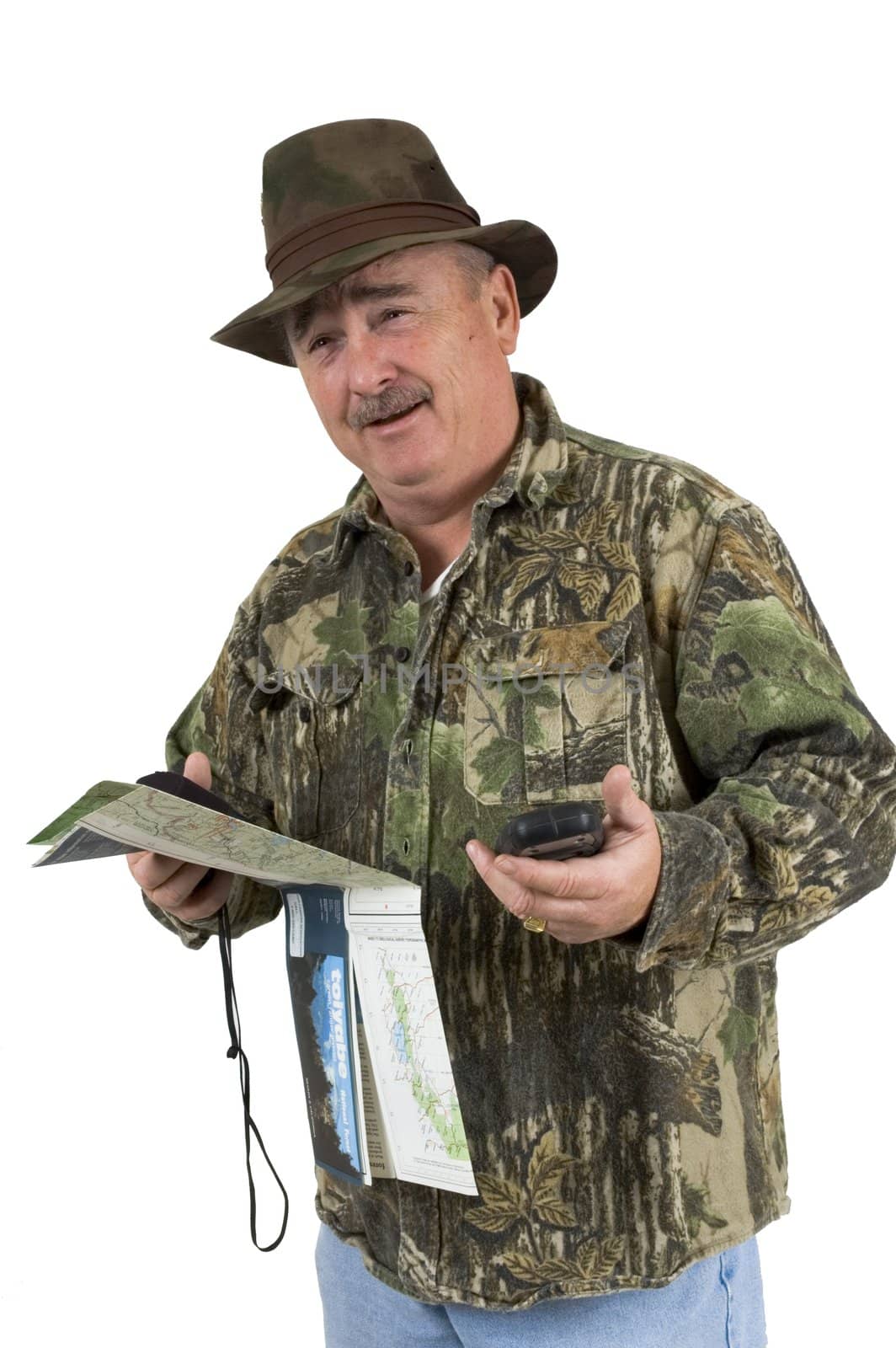 Man in Camouflage clothing using national forest maps and two gps's to check position on a white background
