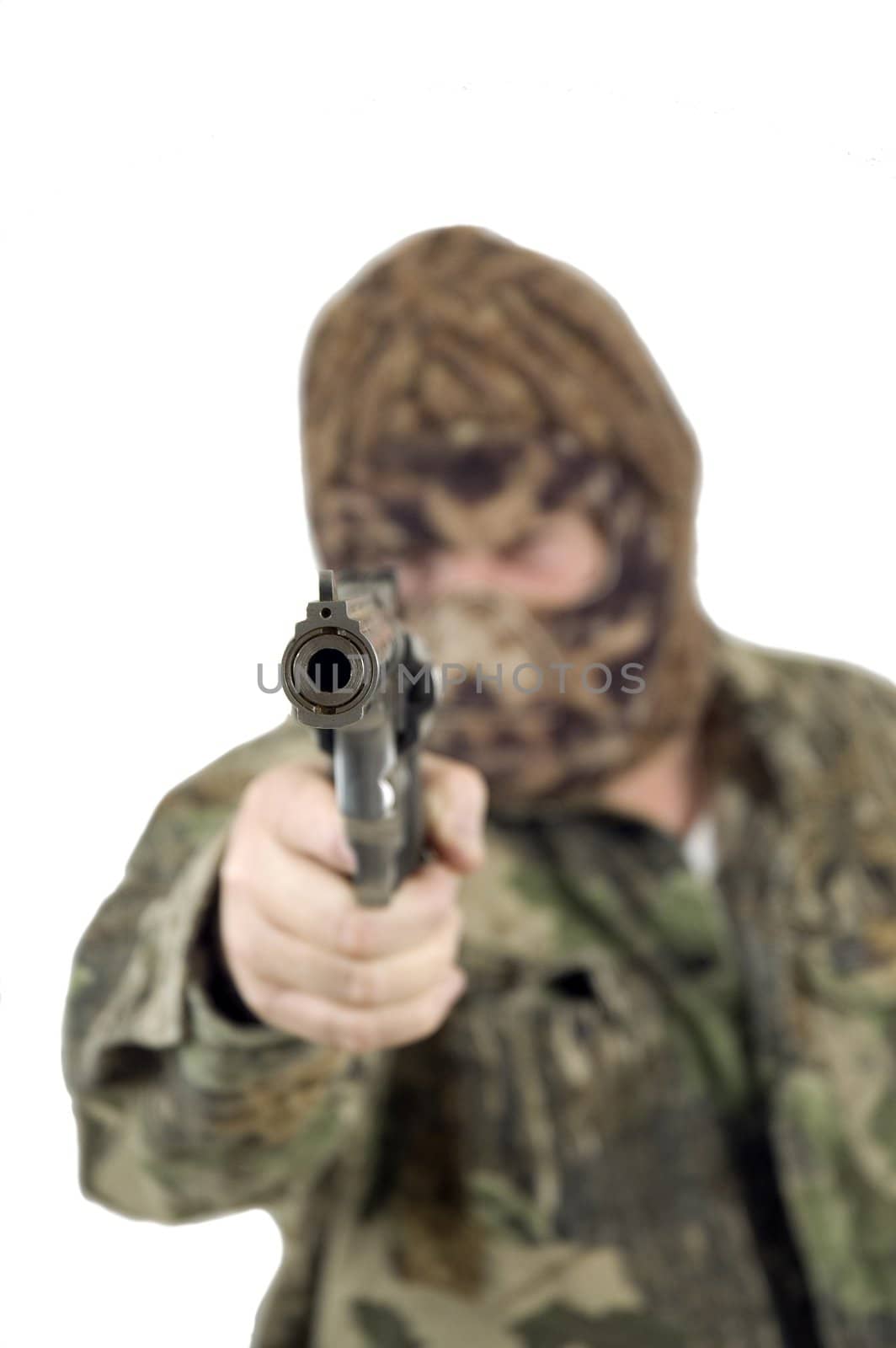 Looking down the barrel of a 41 Magnum revolver held by a masked gunman