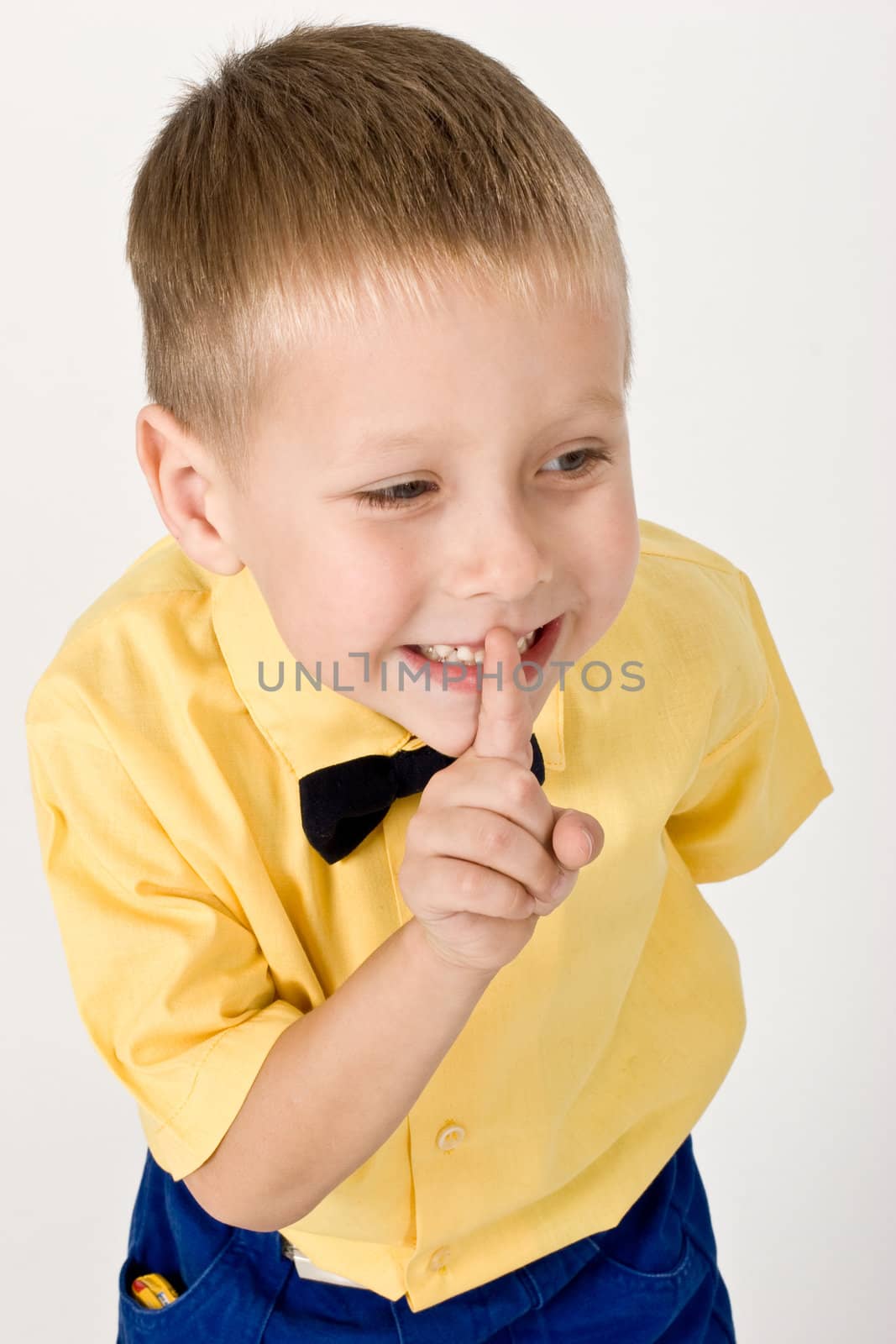 portrait of little boy on the yellow shirt