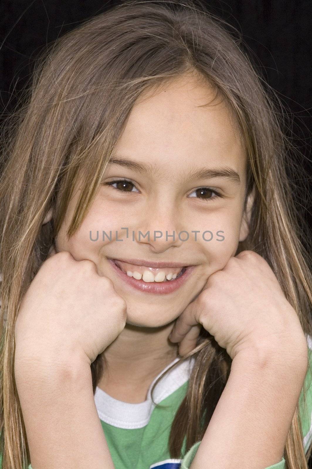 cute caucasian american girl resting head on the hands 