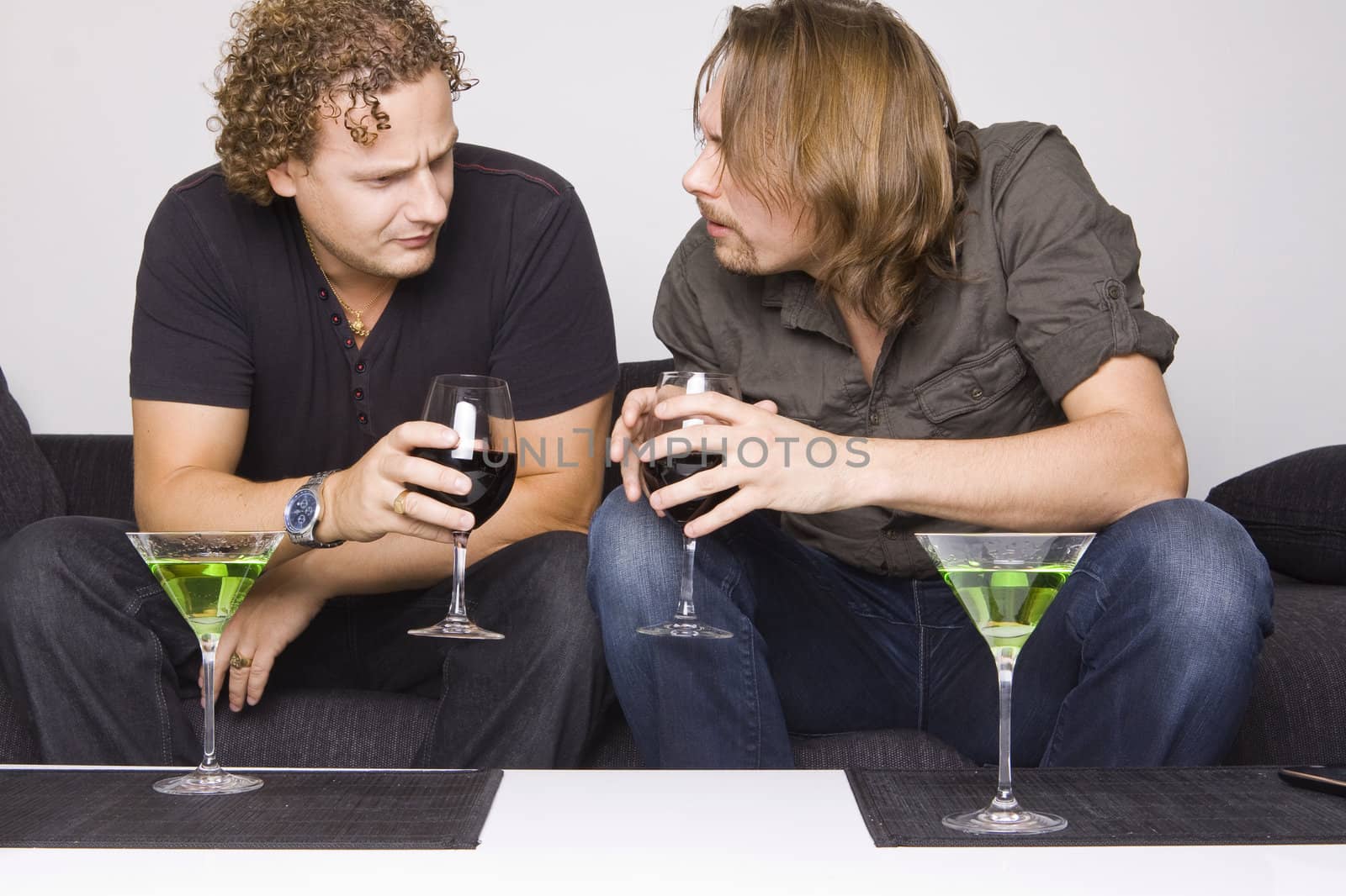 two friends drinking at home (grimacing)