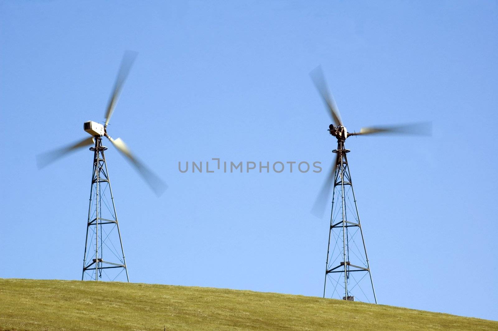 wind generators in california taken at a slower shutter speed so as to illustrate the speed of the blades