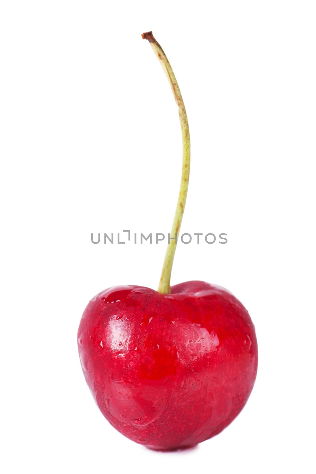 Close up view of heart shaped cherry isolated over white background