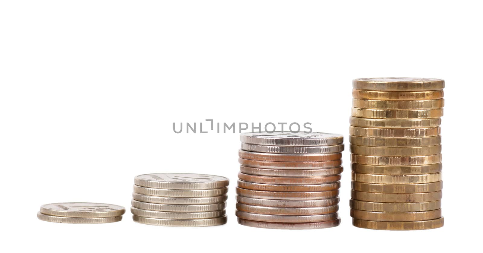 Raising stacks of coins isolated over white