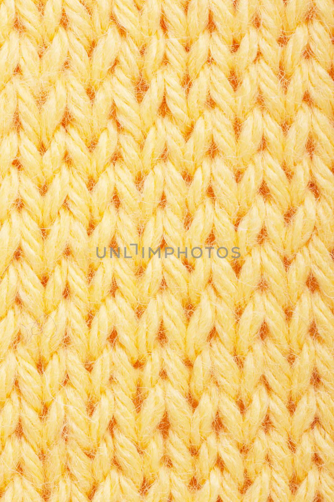 Macro view of yellow knitting.