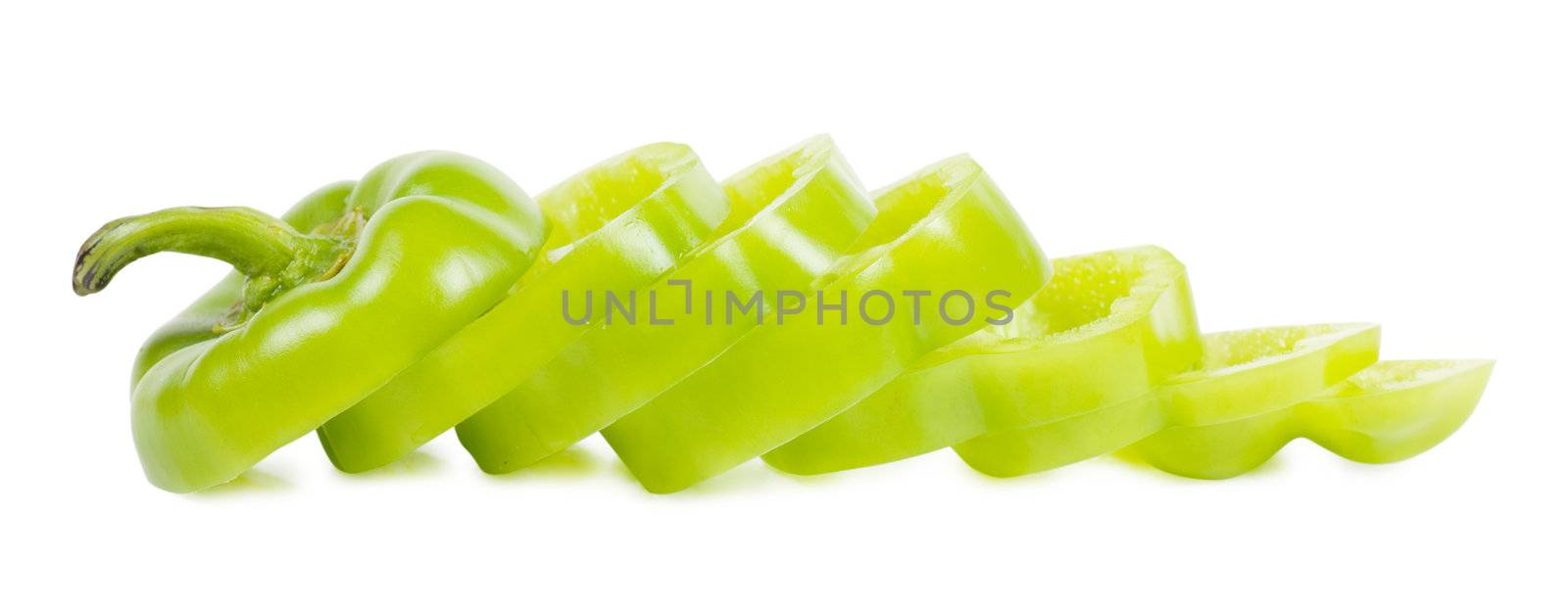 Sliced sweet green pepper isolated over white background