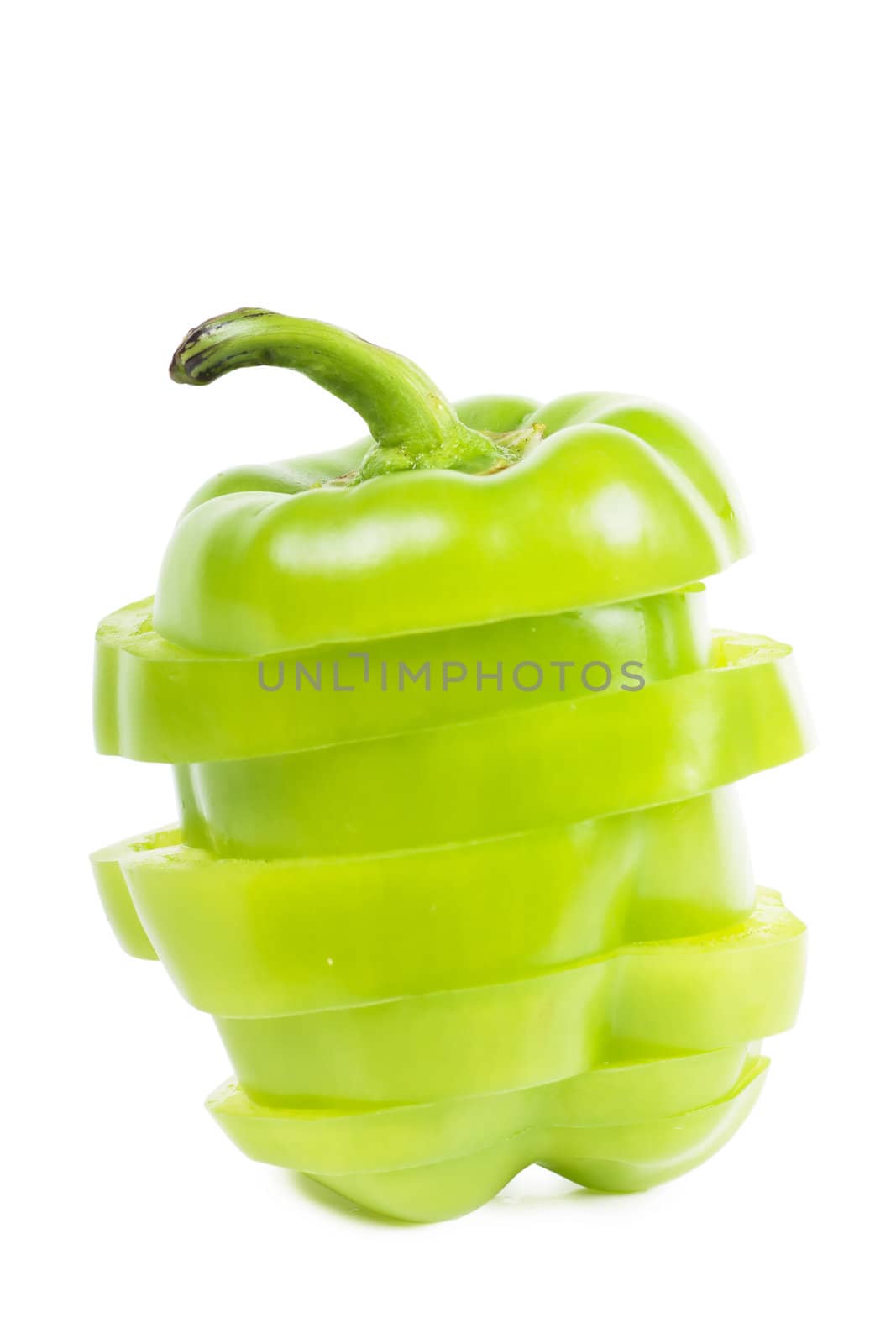 Cutted sweet green pepper isolated over white background