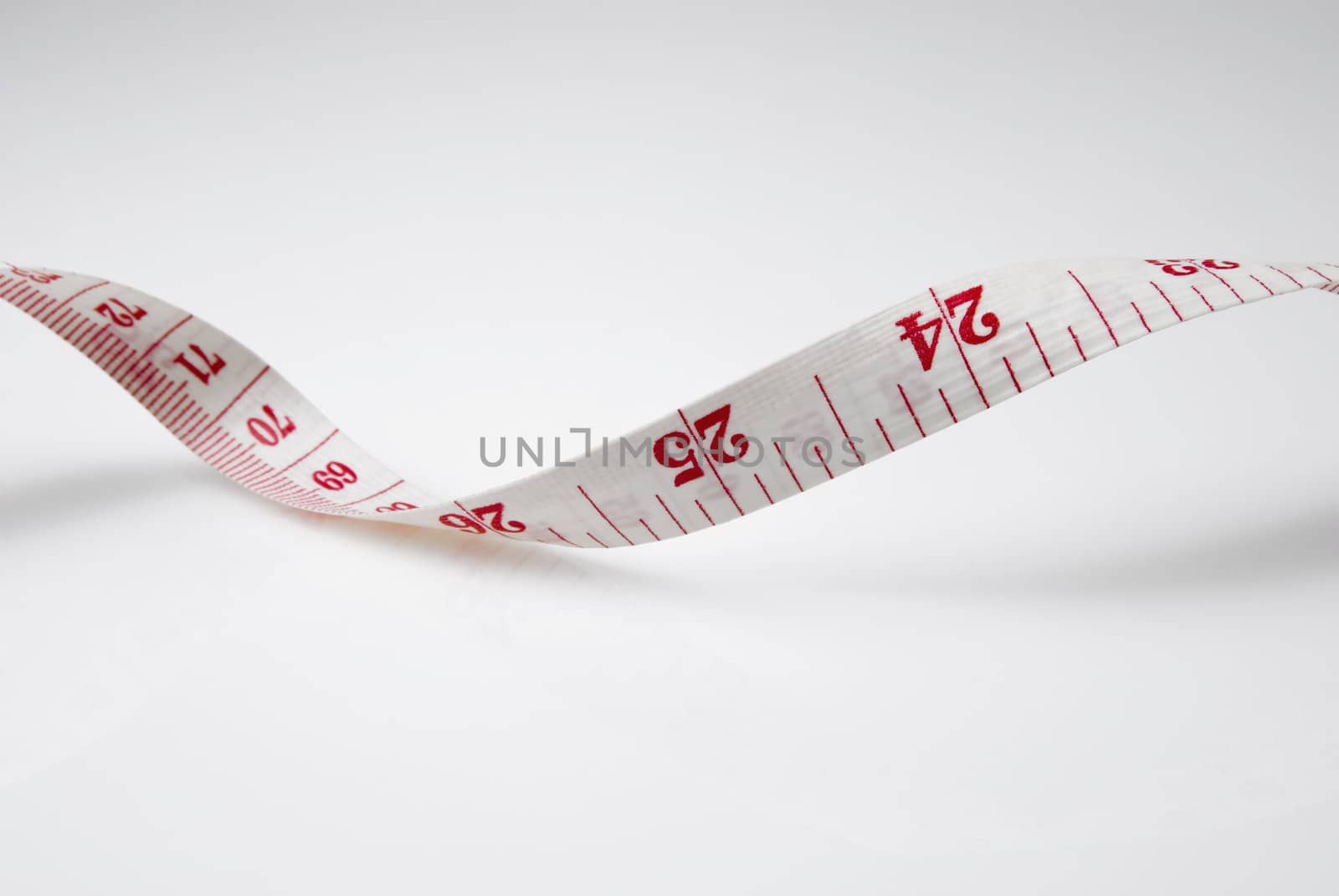 Studio shot of measuring tape against white background