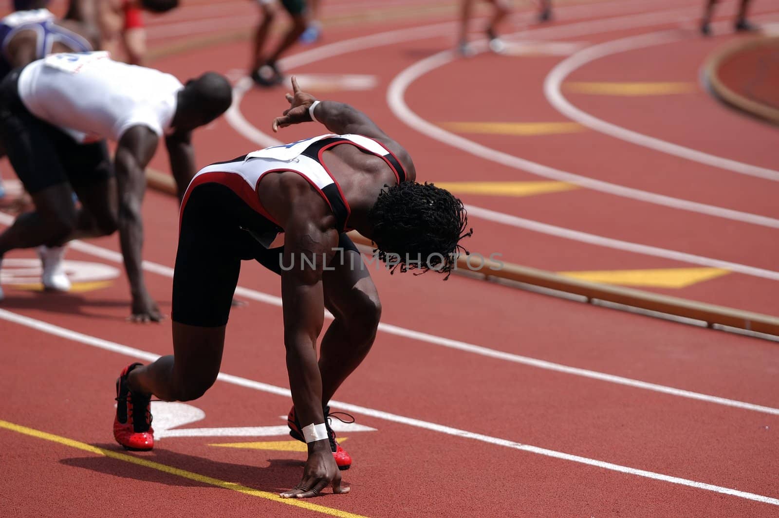 Runner waiting to receive the baton on a 4 x 400 mm relay.