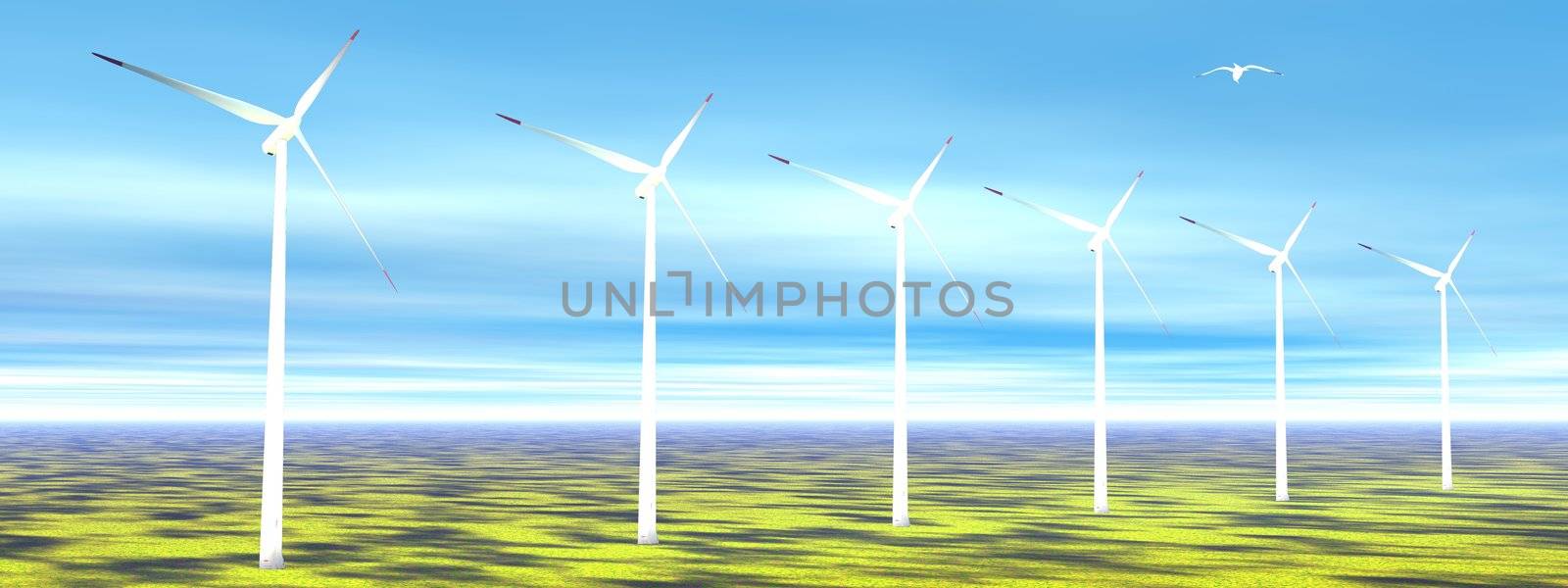 Bird flying upon wind turbines on a green grass meadow and blue sky