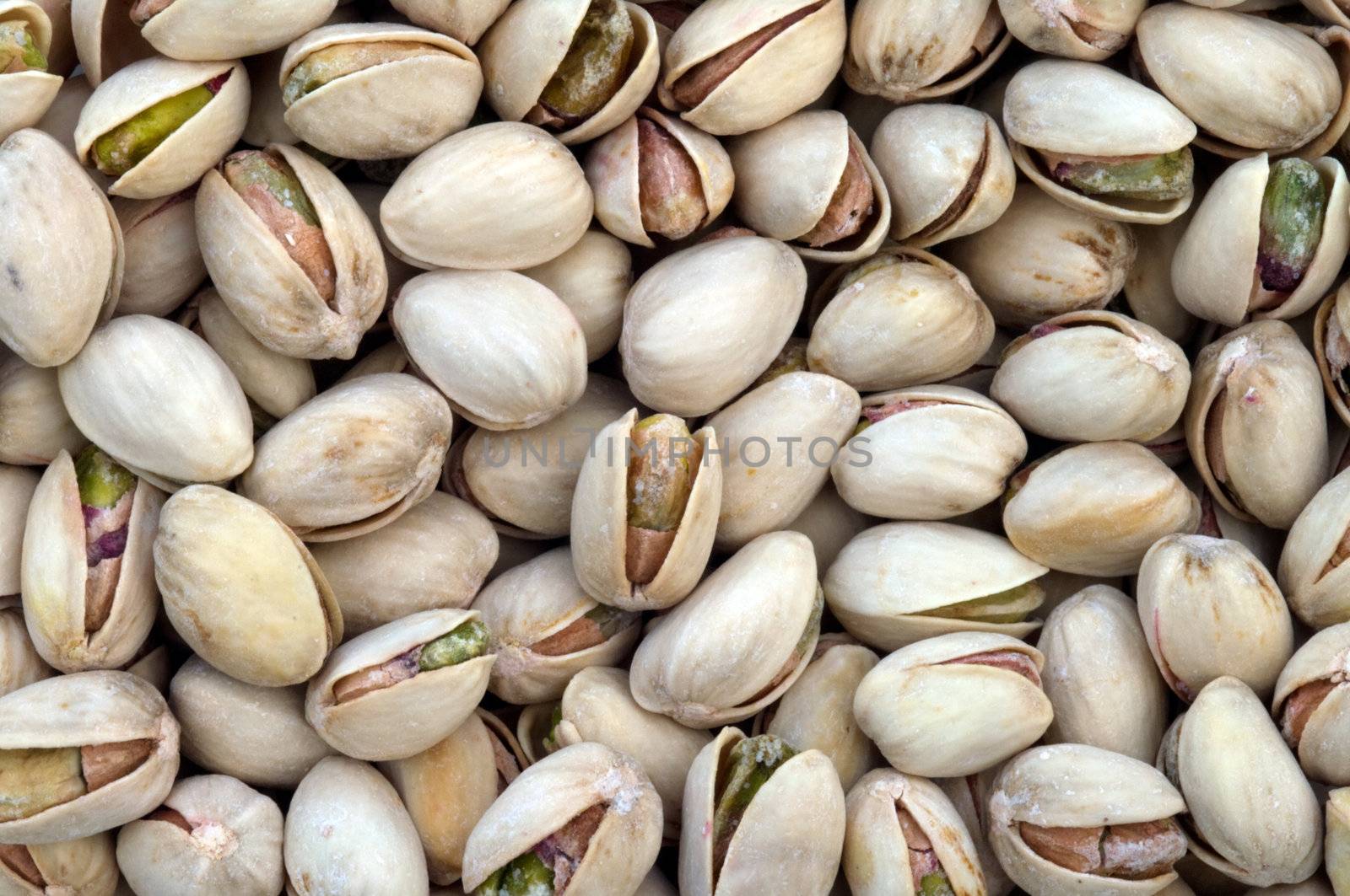Background from the nuts of pistachios close up.